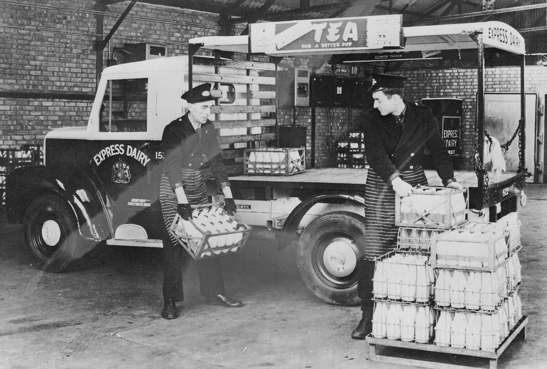 1953 Express Dairy Milk Float Being Loaded. Dave Fane comments "The bodywork on Trojan 1570, and I would think the other ones, was done by Strachans of Acton, where I expect the photos were taken. Float 1570 was sold on after about two years with Express." (Courtesy Trojan Trust)