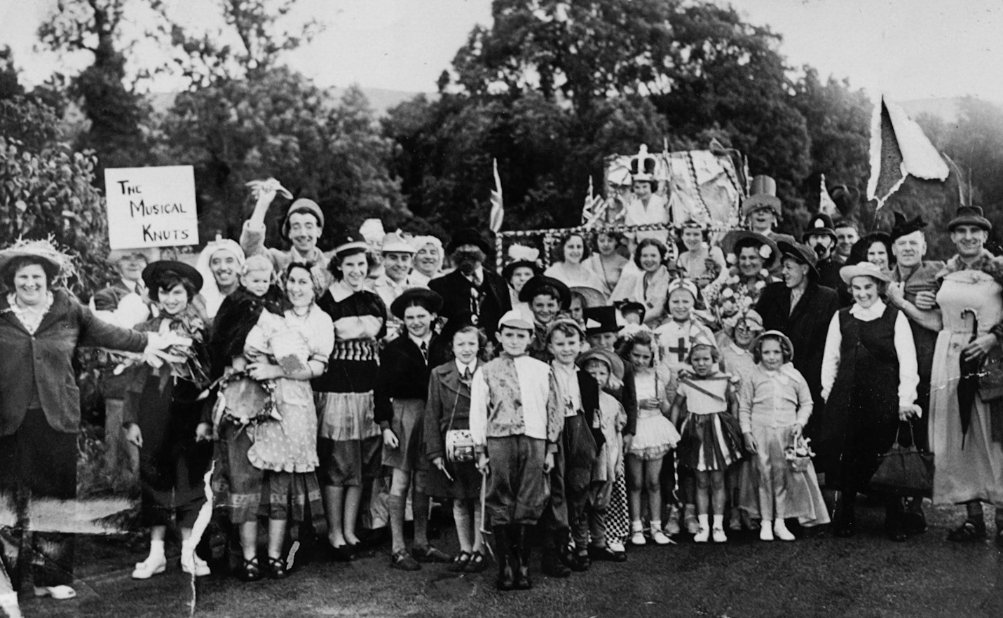 1953 Coronation, Waterwheel Minsterley. Kathryn Purslow recognises "My dad Tony Purslow, left of the jockey in the front." Shirley Rowson identifies the 'Queen'-Shirley Rowson nee Childs, Attendants-Dorothy Childs, Jean Gittins, Joan Purslow, Eileen Crowther. Ken Childs in the tall hat, Ralph Crowther, Beryl Crowther, the nurse Rosemary Harris nee Childs, Cyril Jones, Betty Jones, Gwen Jones, George Beamond, Tony Beamond, Purslows and many more. Jo Betts adds "I think Beryl is holding me - Josie Purslow" (Courtesy Joe Lyons)