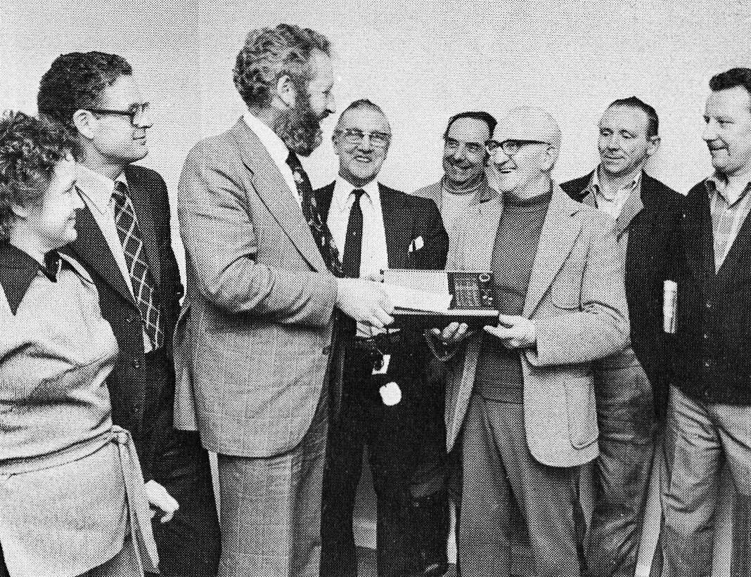 1977 Stanley Sparks, former ice cream delivery merchant, moved effortlessly from sterilised milk to supervision and stayed with us for 49 years. His farewell gift would seem to be a transistor radio presented (L to R) by Bradford Model Milk chums: Irene Wild, John Woodhall, Bryce Benson, Alan Stead, Les Broughton, Les Brannon and Derek Button. (Picture from Bradford Telegraph & Argus, Express News Summer)