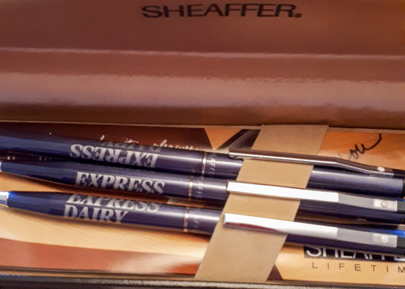 1991 Sid Marie, milkman at Northwood Depot retired after 50 years. Christine Kempster, his daughter, comments "Dad's long service awards-the red tie was 45 years I think. I spent many hours as a child polishing the silver cigarette box! I have all his long service awards...badges and ties with the little train motif, a silver cigarette box and my brother has a watch."