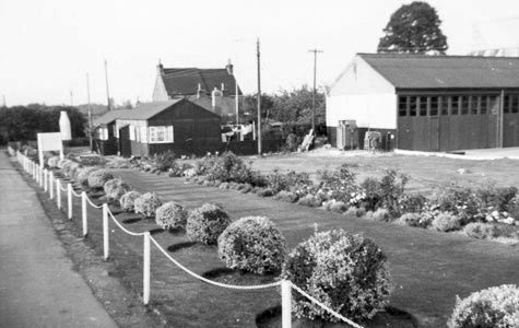 1950's Job's Didcot. Albert Snodgrass comments "Garage and Paint shop to the right of bungalows". Margaret Blake "We used to live in the first bungalow near the milk churn, then moved to the house on the left behind the bungalow-Thomas and Audrey Barnes, myself and my twin brothers Mark and Ian". Josephine Napper added "I’m Josie Warren, I used to live at Marsh Cottages, we used to play together x." Tina Chitty adds "I loved seeing the huge bottle when I was little."(Courtesy Albert Snodgrass)
