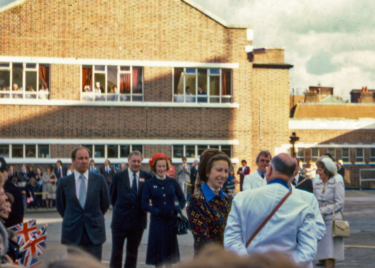 1980 South Morden, Princess Anne visit, with some of the onlookers outside the canteen block. (Express Dairy Tales collection)