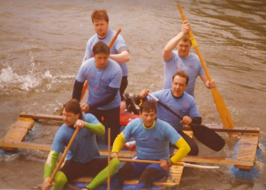 1992 Exeter Raft Race. Bob Wigmore and Frank Pile recognise, from the back: Bob Wigmore, Stuart Hunt, Stan Hodgkins, Frank Pile, Ady Jones, Steve Evans. Mark Chapman adds "Pretty sure that's me in front, next to Steve Evans."