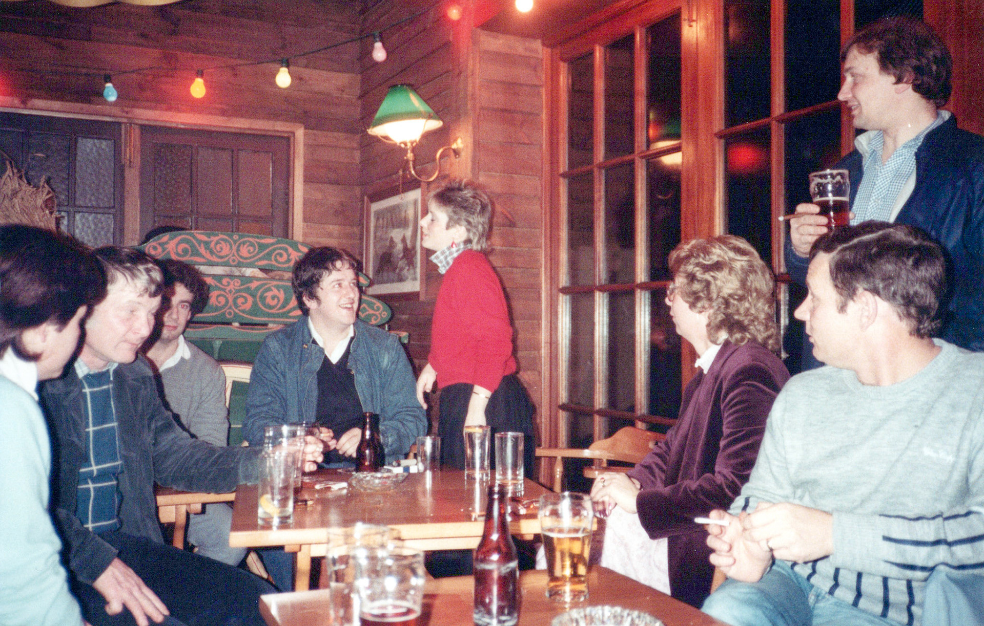 1983 South Morden Management at the pub. Left to right: Louise McWhirter, Paul Mlldner, ?, ?, Suzanne Thomas, Sheila PInk, Joe Taylor (standing), David Gambriel.