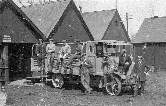 1920's One of the first lorries bought by George Horner in the 1920s. The chap at the front is Jack Sexton, Horner's worker and one-time owner of Cuddington Garage. Those hard tyres would make for a bumpy ride but the horn looks fun, from 'William Horner and His Creamery' by Jill King 2012