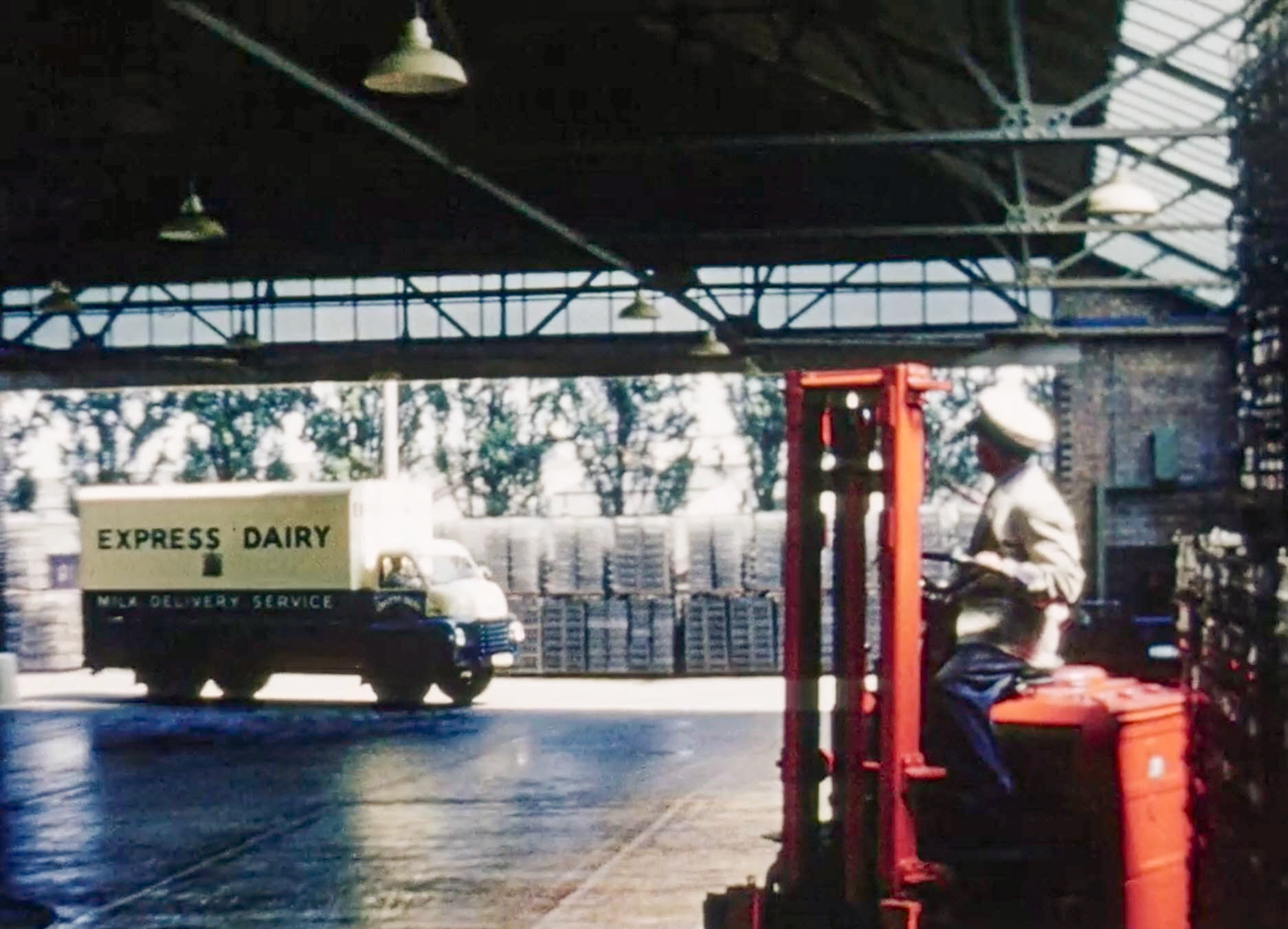 1954 South Morden Processing-empty bottle unloading bank. (Stills from Express Dairy Film)