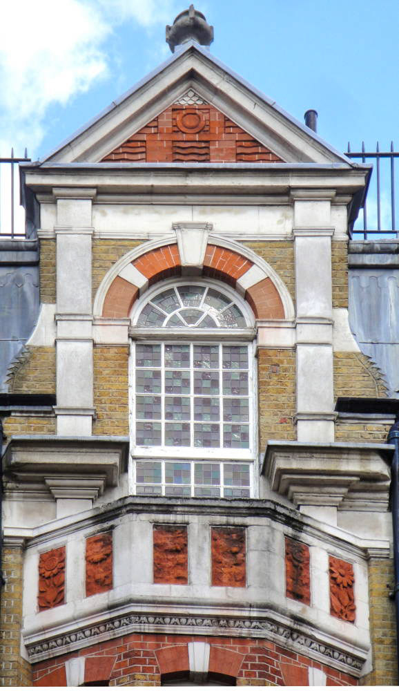 Dairy Supply Company (now Pizza Express) Architect: R.P. Wheelock. 1888. Location: 30 Coptic Street and Little Russell Street, WC1. Courtesy(Photographs and caption by Robert Freidus. Formatting and perspective correction by George P. Landow https://victorianweb.org/sculpture/architectural/92.html)