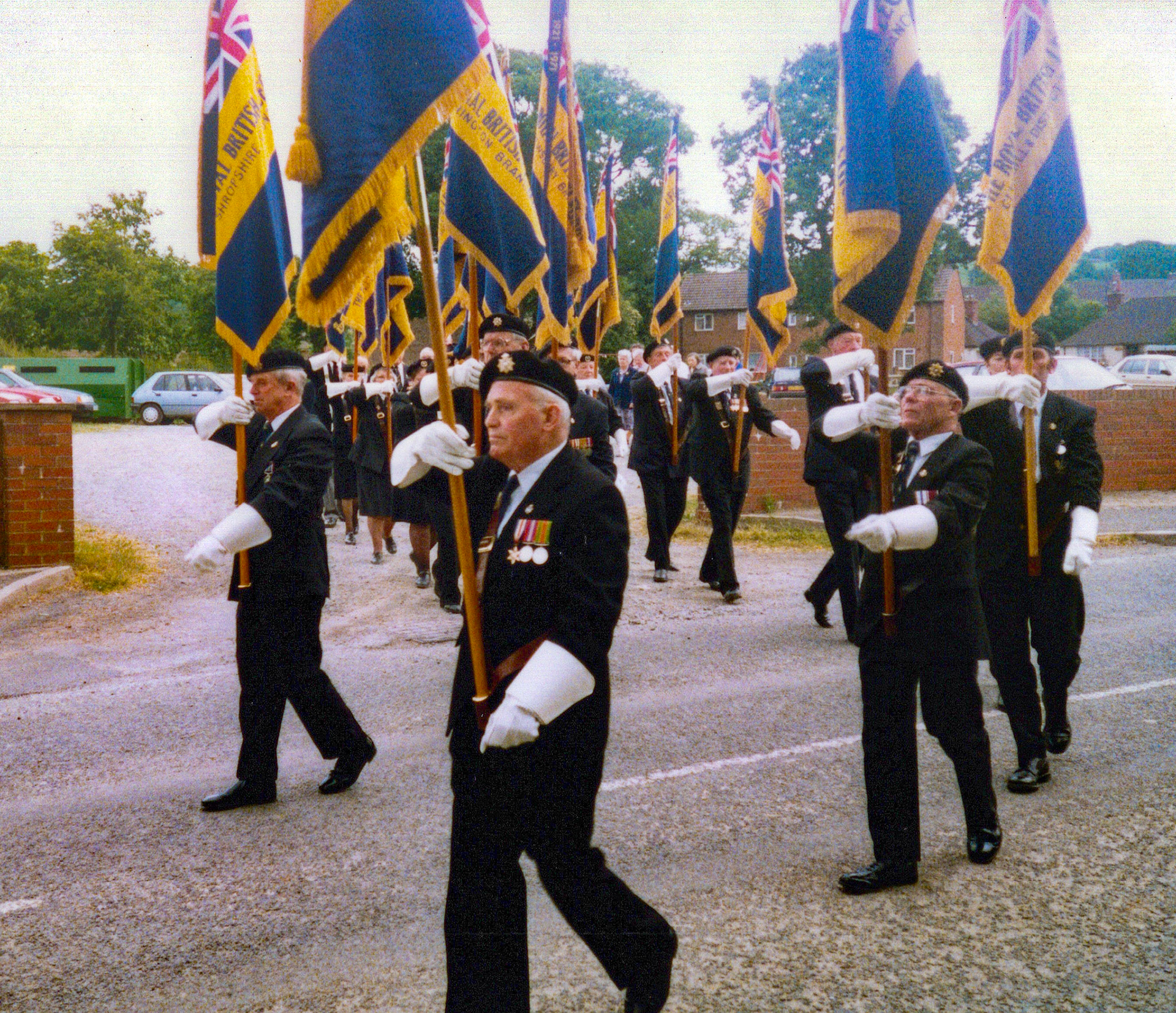 1980's Minsterley British Legion. Irene Stelfox comments "Roy Fox, with the standard, a lovely man, looked after the church clock." Sandra Lewis adds "Loved the RBL Parades in the summer months. Every Sunday we were at one village or another. My Dad (Wilf Overton) is carrying the Shropshire County Standard on the left at the front. I can name a couple of the other Standard bearer's who came from all over the county to these parades." (Courtesy Joe Lyons)
