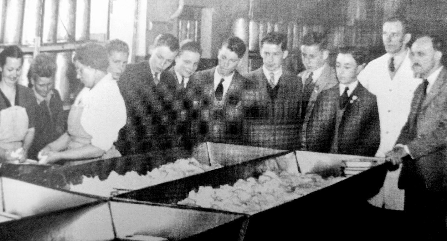 1947 Tuxford &amp; Tebbutt Ltd. Ann Musson comments "Owner John Crosher and a lady worker show John Greenslade and a group of local schoolboys how Stilton cheese is made." (Courtesy Ann Musson)