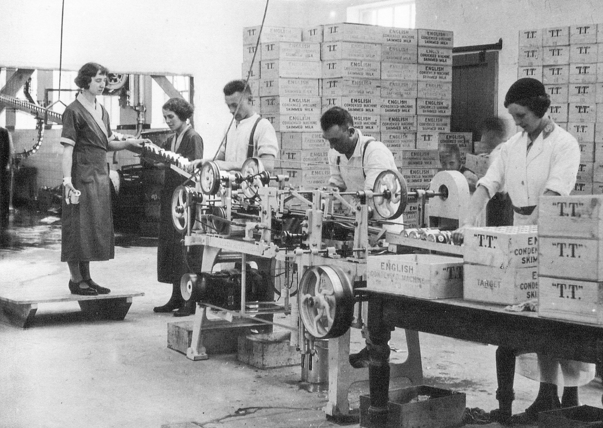 1930s Maisie Preston second from left  working at the creamery, packing 'English condensed skimmed milk'. Wife of Richard Preston, Minsterley Creameries Chief Clerk at this time. (Courtesy Lynn Fickenscher)