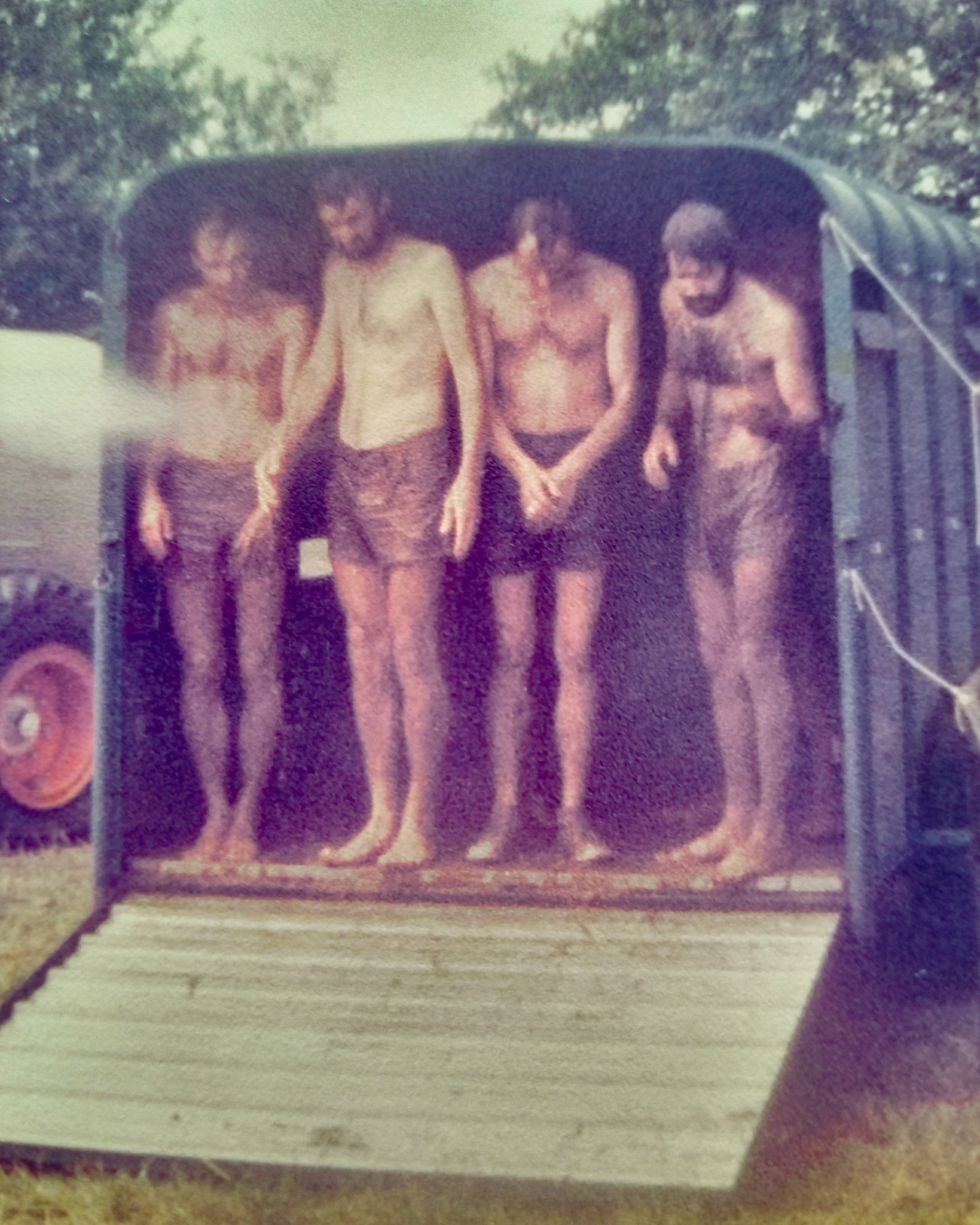 1985 Honiton staff at the East Devon Mud Games tournament... being hosed down after the event. Tim Pearce, 'Snowy' Salter and two others. (Courtesy Tim Pearce)