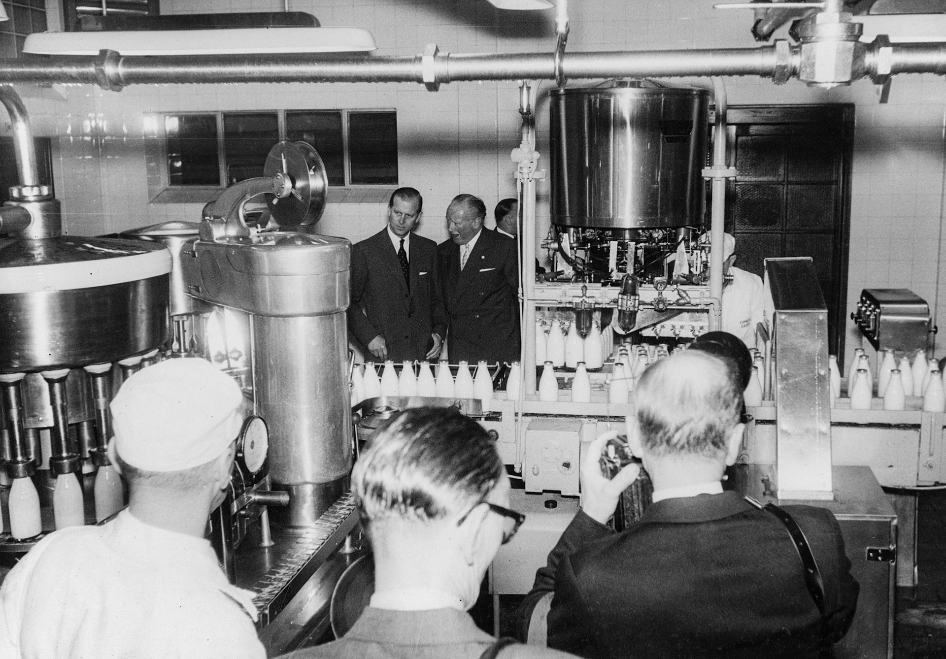 1957 South Morden-Duke of Edinburgh's visit on November 12-bottle filling and capping. (Courtesy Paul Luke)