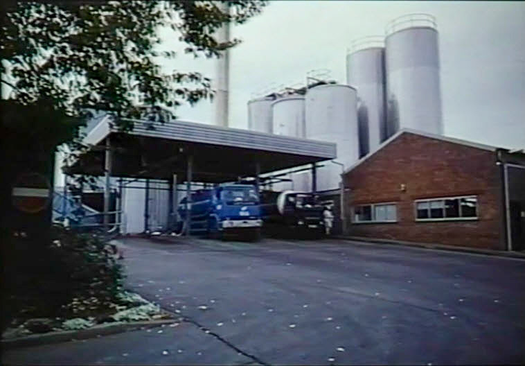 1990's Ruyton Milk Reception. Gerald Mills, on the Milk Tankers of the U.K Facebook Group. "A story that came from delivering milk into Ruyton XI Towns. The boiler at the dairy was in front of the deck where we used to collect the washed churns, and was oil fired. The oil was delivered on Scammell Highwayman artic. tankers. A number of drivers were all in the canteen nearby whilst one of these tankers was unloading when we heard an almighty 'wummph'; they rushed outside to see the driver hadn't vented the tank before unloading. The story went on that later next day another tanker was sent to Ruyton and proceeded to pump oil back into the collapsed tank and it eventually expanded back into a rough shape sufficient to return back to the terminal for scrapping or repair." (Stills from Ruyton Video (Steven Harley))