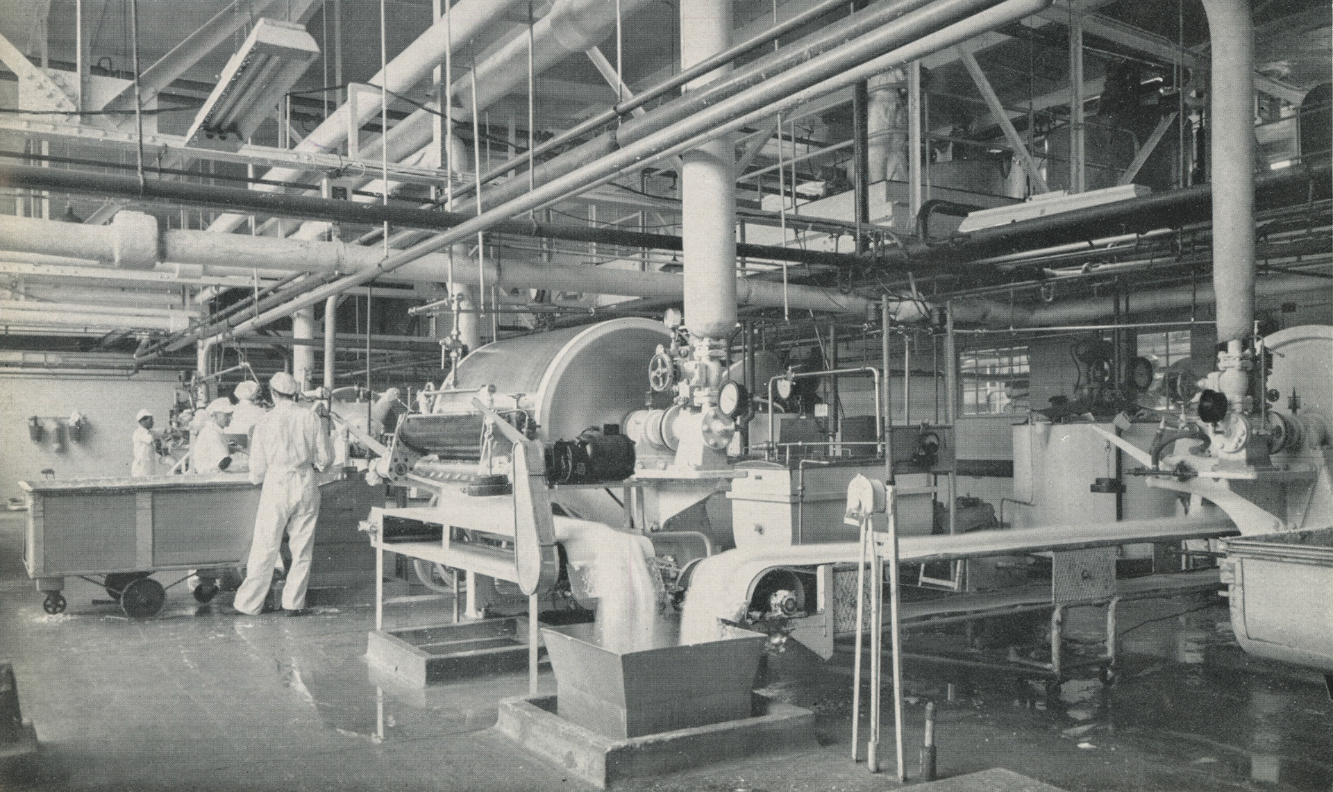 1964 Mitcham Foods drum processing floor where margarine flakes are produced in bulk for the bakery trade. Philip Boyd comments "We built a mezzanine platform, something to do with making jelly. We went there and erected it. Didn't like the process cheese packing room smells."