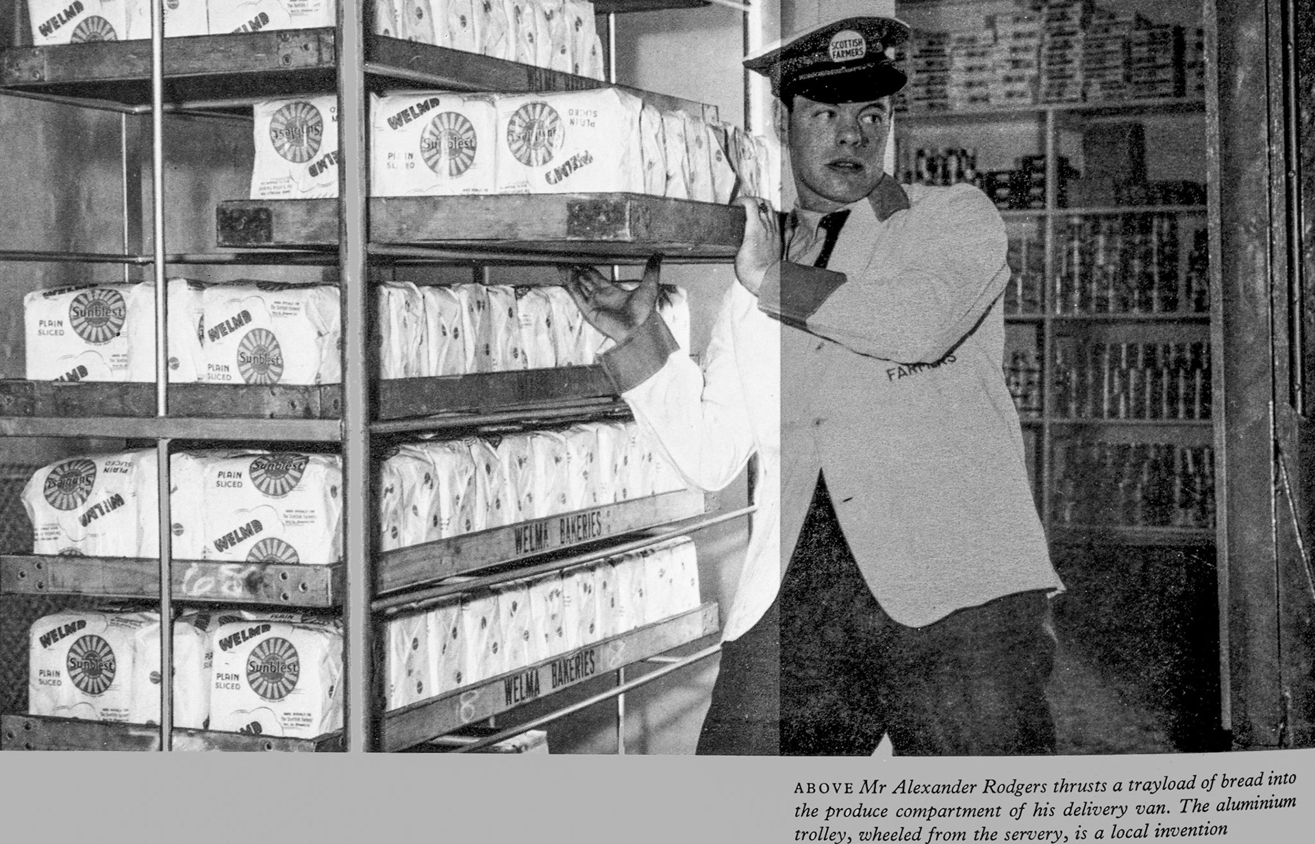 1961 Mr Alexander Rogers loads 'Sunblest' plain sliced bread into his delivery van at MillRoad Street, using an early form of aluminium trolley. (Express News Autumn)