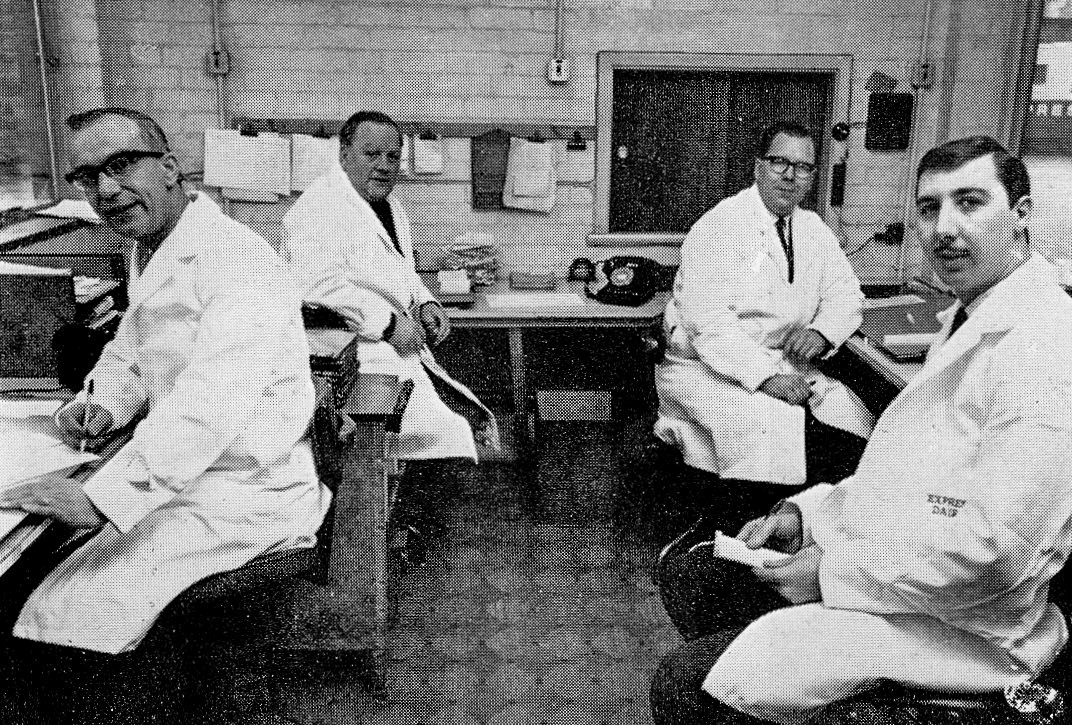 1968 Wakefield. Checkers' Office, four men control the outward flow of milk-Joe Bradley, Social Club Chairman John Hodgson and committee members Ken Dawson and Trevor Ashton. Christine Bradley comments "Joe Bradley was my husband's uncle.". Glennis Rodgers added "Trevor ended up as HR Director." (Express News Summer)
