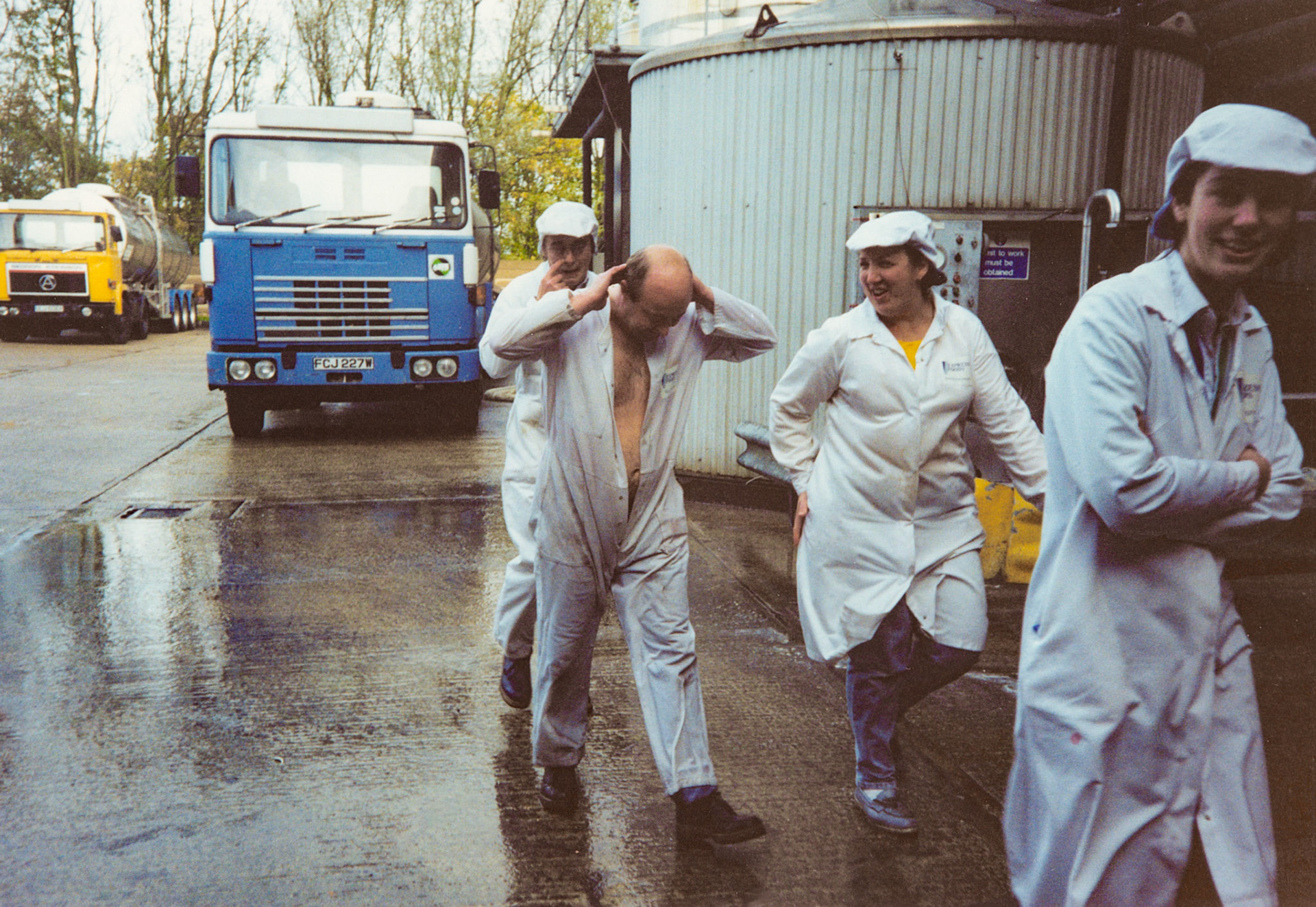 1991 Honiton, November, following closure announcement: 'A drenched Roy Lovering '-Pat O'Connel, Sheila Webber and Peta Wakeham (Courtesy Wendy Hawker)