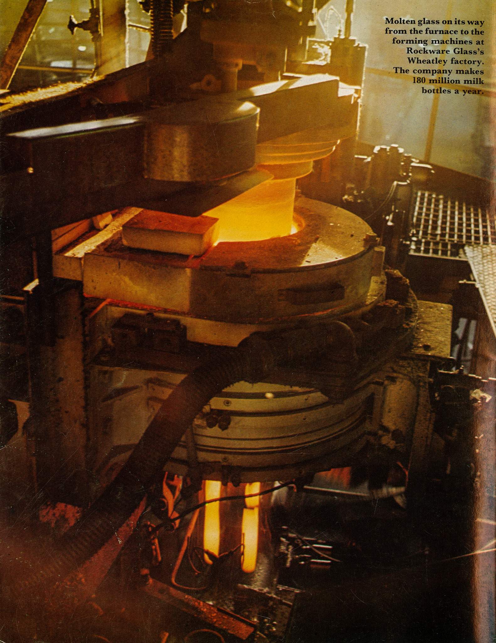 1981 Molten glass on its way from the furnace to the forming machines at Rockware Glass's Wheatley factory. They make 180 million milk bottles a year.