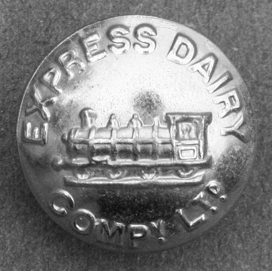 Button from an 'Express Dairy' roundsman's coat. Stephen Jennings comments "These were on the black winter jackets if I remember". Raffaele Ralph Phillips adds "We had sixpence taken out of our wages in the early 70's which paid for our winter overcoats, necessary for working outside of our garage-black in colour with these buttons, definitely kept us warm."(Courtesy Mark Hudson, Real Diggers FB Group)