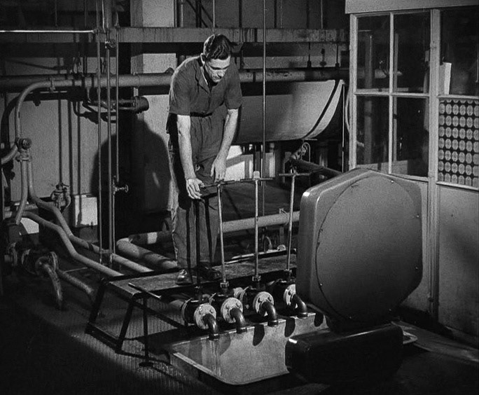 1940's Tower Creameries, later Mitcham Foods, part of Express. Weighing the oil. (Courtesy British Instructional Films, British Pathé)