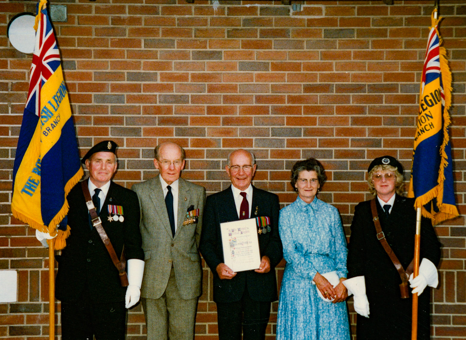 1980's Minsterley British Legion. Kath Lewis comments "My Uncle Bill and Aunty Vi; Bill was my dad Jim's brother." Marion Davies adds "Myself (on the right) and Mr Fox, we did the standard flag carrying for many years-it was a Sunday afternoon at one of Minsterley parades." Christine Griffiths says "My Uncle Bill and my Dad's Sister Aunty Vi, lovely picture." (Courtesy Joe Lyons)