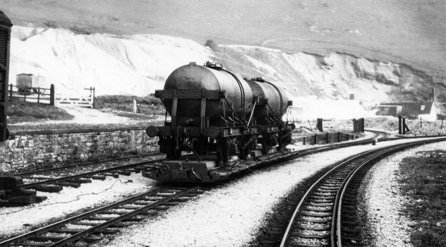 1930's? Mainline gauge Rail milk tanker at Ecton, on a narrow gauge transporter wagon. Alan Salt comments "Farmers and contractors would bring milk to Ecton-some may have been used to make cheese but when excess milk was available, or when liquid milk was worth more to the Company, these tankers would take the milk to Waterhouses, then on to Manchester or London. Wilts United Dairies who ran Ecton were doing similar at their Uttoxeter site so these rail tanks could well end up at Uttoxeter for onward travel." (Courtesy Alan Salt)