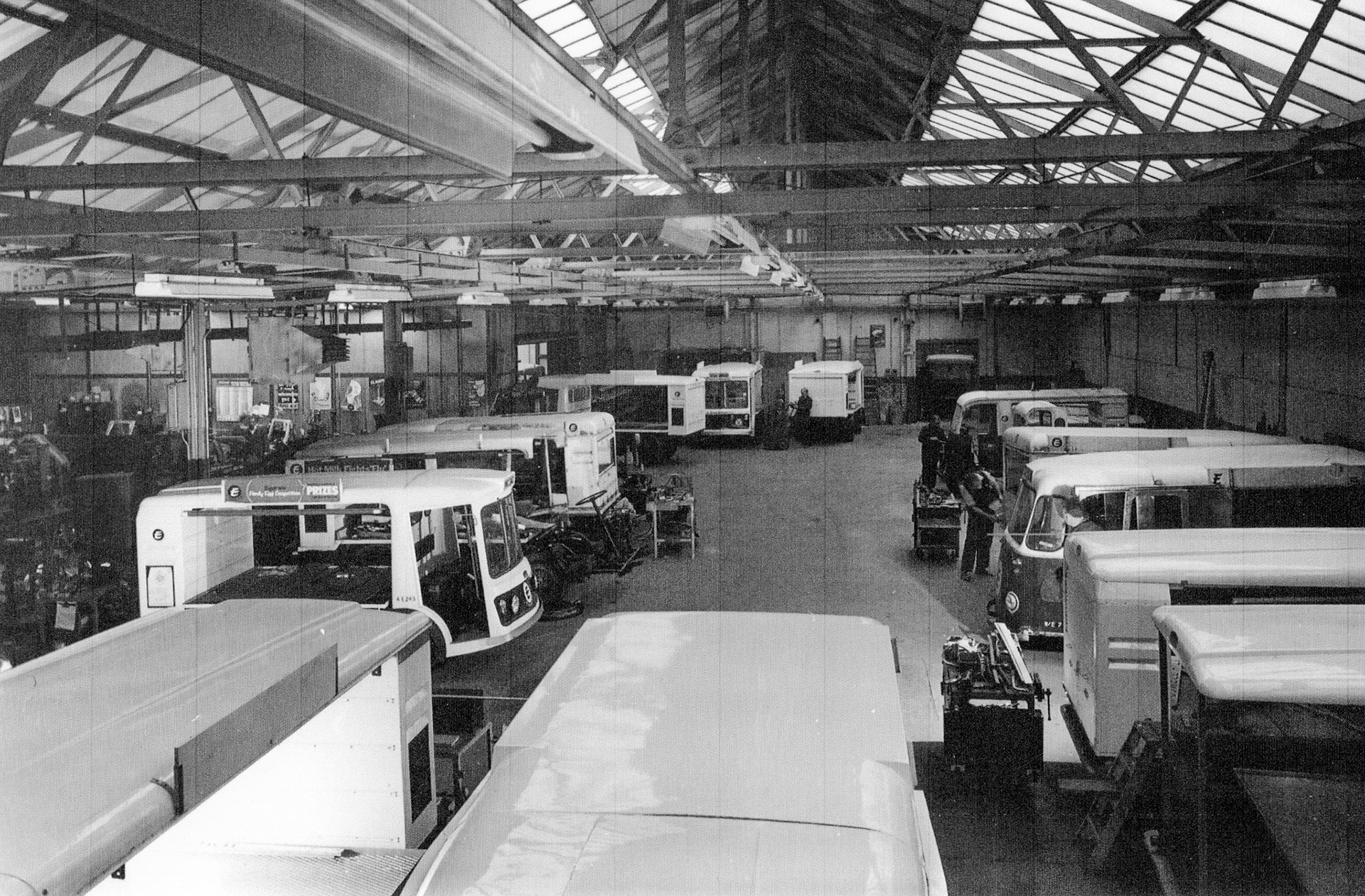 Ruislip Workshops with Reg: WMC341G, FLEET 4E243 on left.  (Courtesy Michael Aldread)