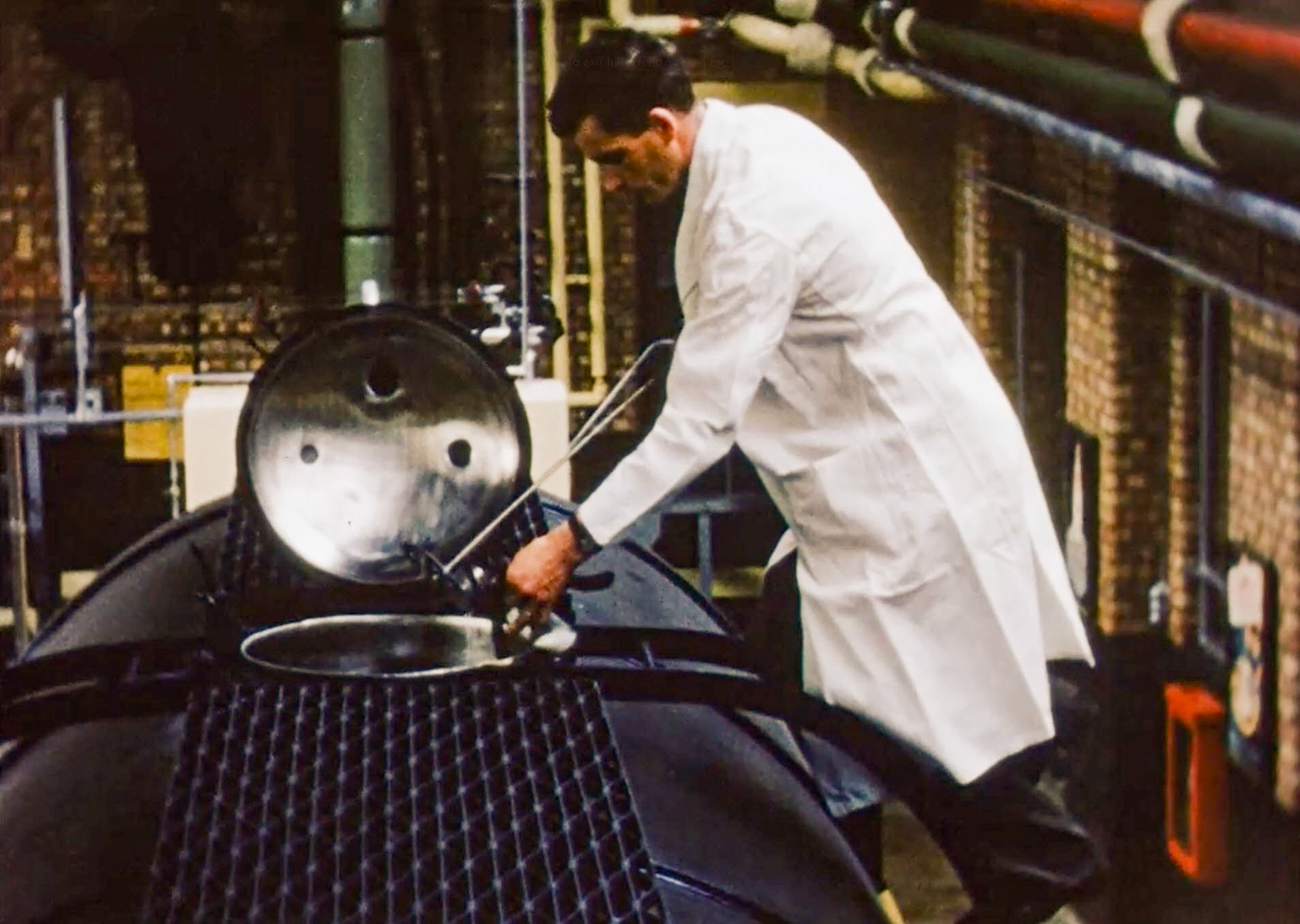 1954 South Morden Processing. Agitating and sampling from a rail tank. (Stills from Express Dairy Film)