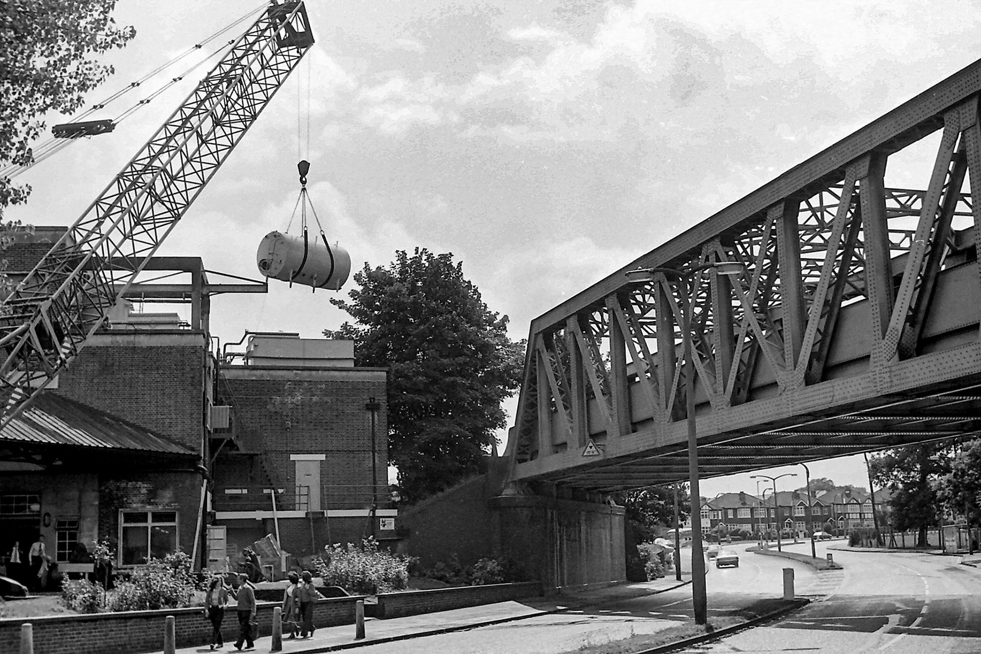 1979 South Morden-new bulk detergent tank installation. Chris Burton and Peter Roper by the main entrance. (Photographer Sam Jones)