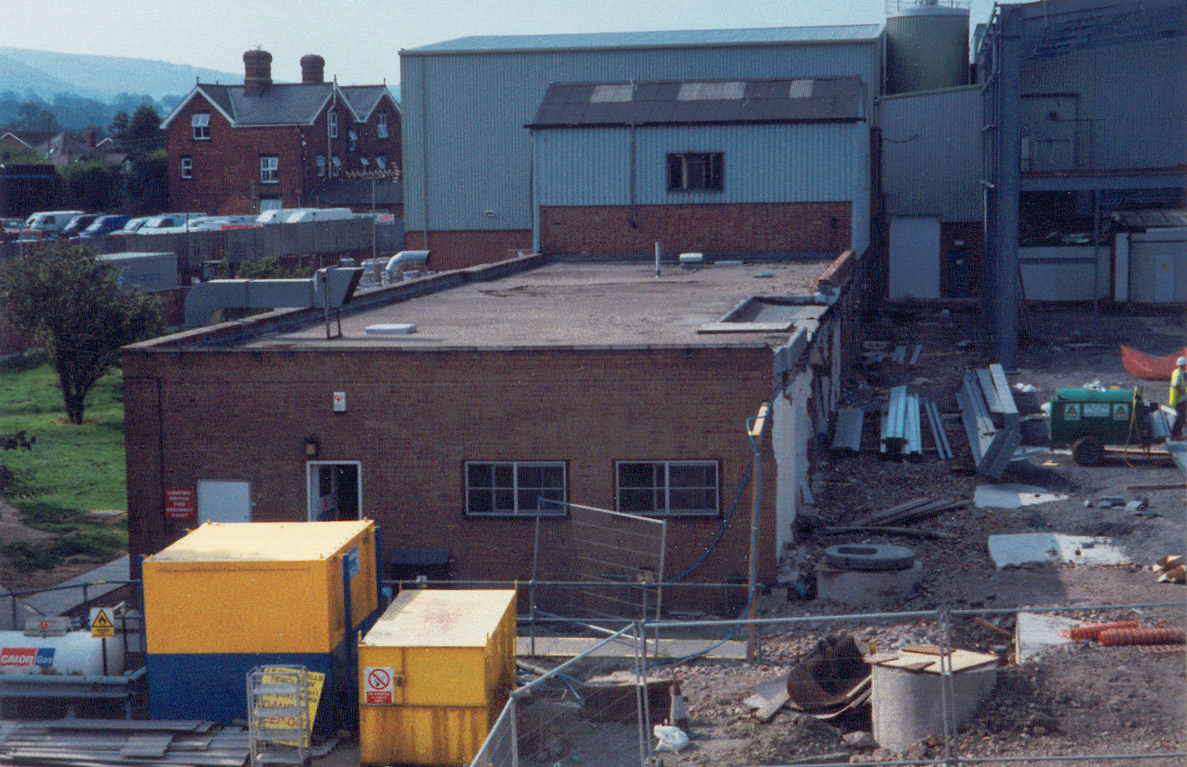 2001 Minsterley Creamery. Patrick Taylor comments "In the foreground is the old canteen block, with the engineering office above and behind". Darren Davies adds "Around 2001/2002 when they built the new desserts building".
