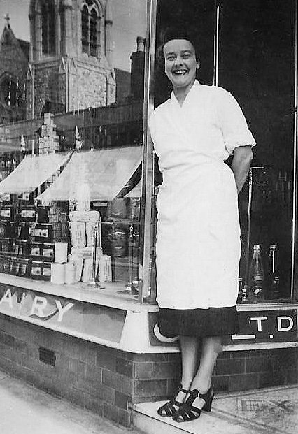1950's Upper Norwood shop on Westow Hill.  Jonathan Austen-Buchanan comments "The church opposite is Upper Norwood Methodist, prior to its rebuilding in the 1960's. The lady is my great-aunt, Ivy Bridle, who was manageress of the window display department. (Courtesy Jonathan Austen-Buchanan)