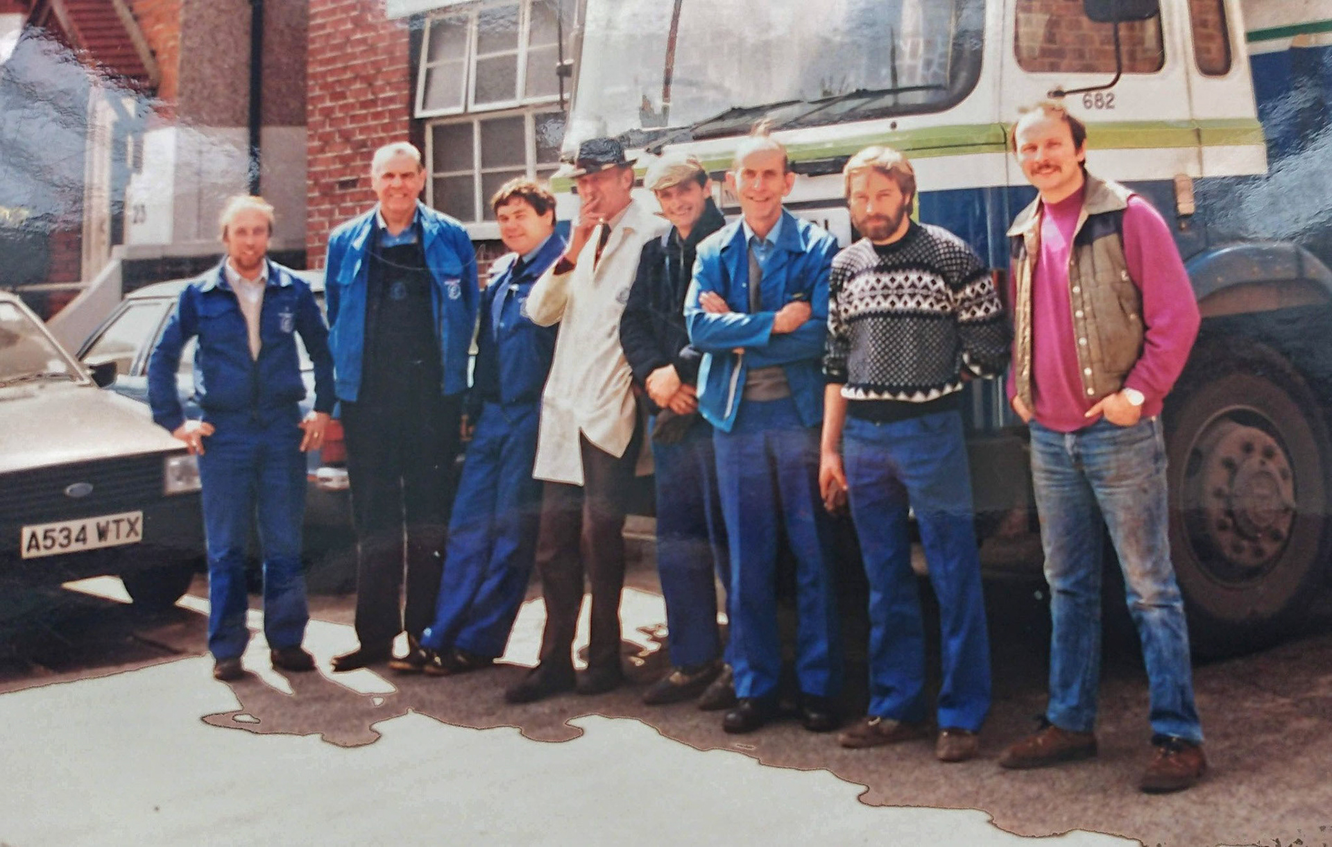 1980s Bromley Distribution. Colin comments "Me far left, George Lee next to me, Roger Golding, in the white coat George Cavill Transport Manager, Bob Heath, Doug Thompson." Raffaele Ralph Phillips adds "I remember George Cavill, the Transport Manager, as l would have to contact him when l was sent over from the Morden maintenance garage to do the electrical repairs on the units or trailers. He had a small hut-like office in the yard, think he smoked roll ups..." (Courtesy Colin Bristow)