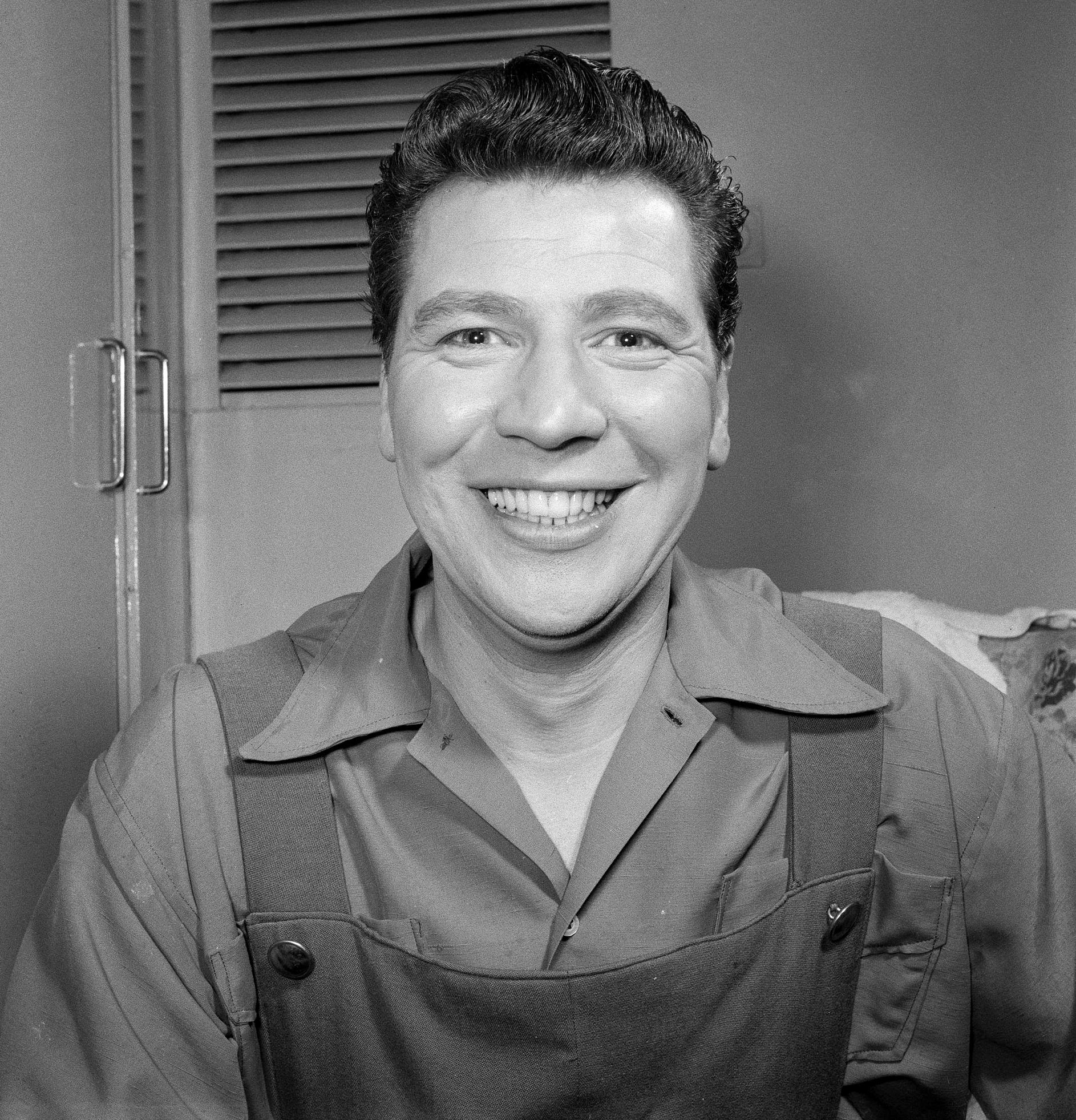 1955 Max Bygraves (singer, actor and comedian) William D T Davis writes "My Grandfather Ernie Davis and his brother Bill became milk roundsmen after returning from the Great War in 1918, working for "Jim Evans" Dairy in Rotherhithe. They were with Davies Dairy in Lower Marsh, Waterloo, when Express bought them out in 1937. Just before the war, they shared a lovely, pleasant hardworking young school boy and his brother as a helper around the Rotherhithe Tunnel-couldn't have got a harder and honest helper, called Wal Bygraves… after the War and service in the RAF, marrying his girlfriend he met in the RAF, he changed his name to Max Bygraves. Lovely, lovely bloke." (Photo by Asher/Daily Express/Hulton Archive/Getty Images)