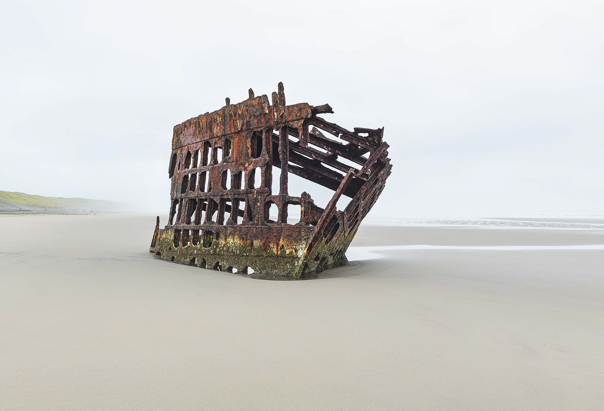 Shipwreck hugged by fog
