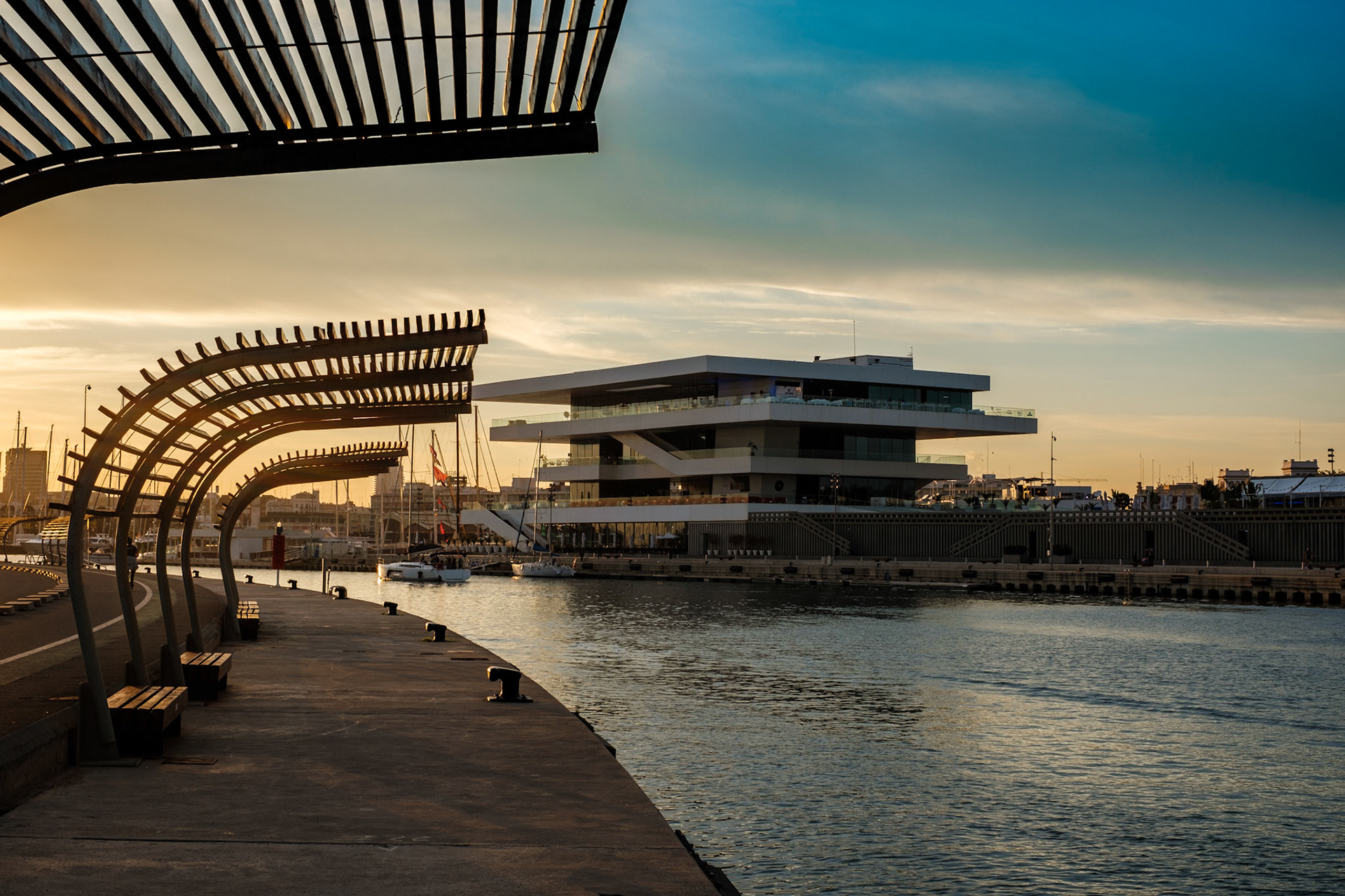 Veles e Vents building seen from the harbour shore with calm sea, Valencia Spain