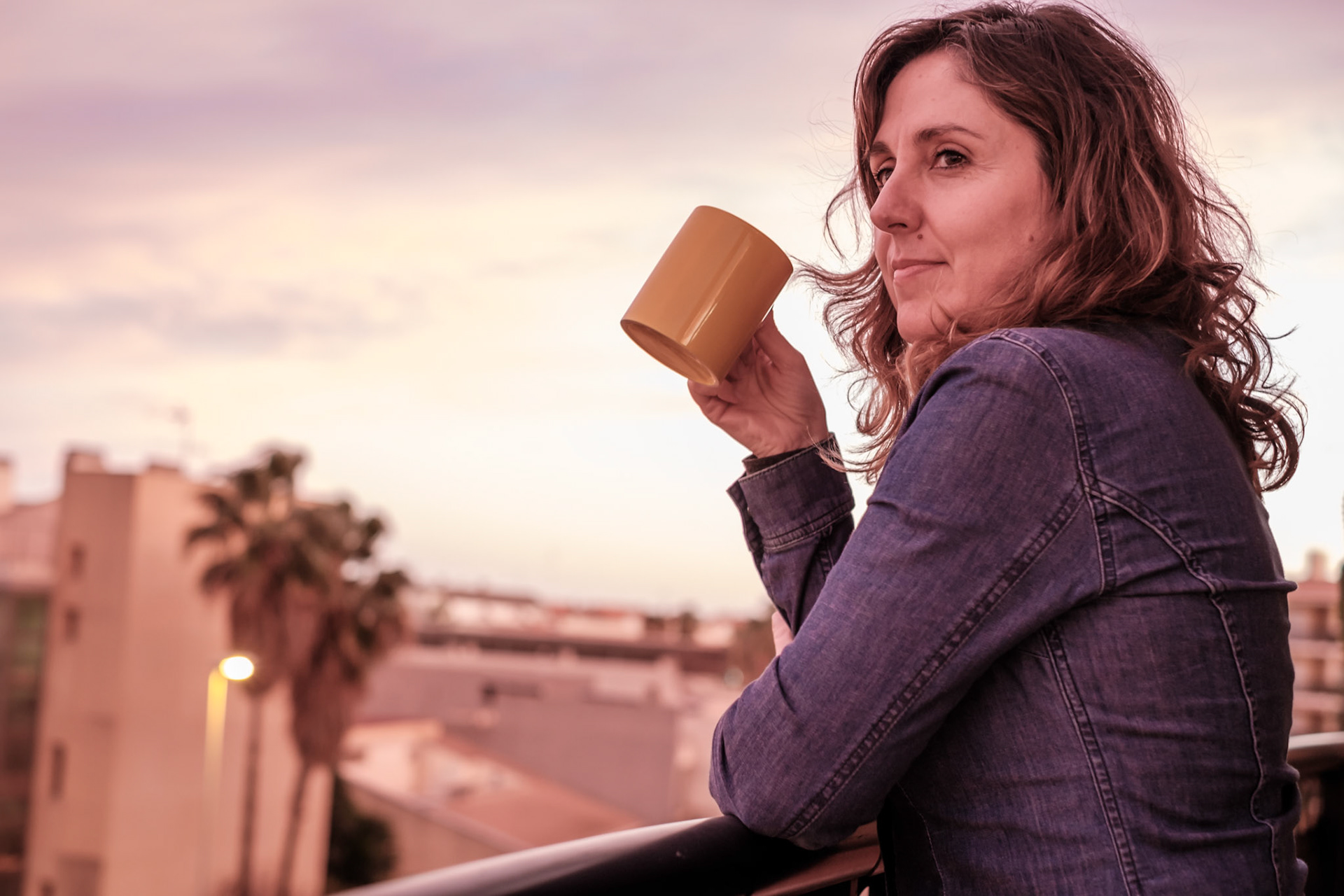 Baby Boomer woman relaxing over a mug of coffee Thinking