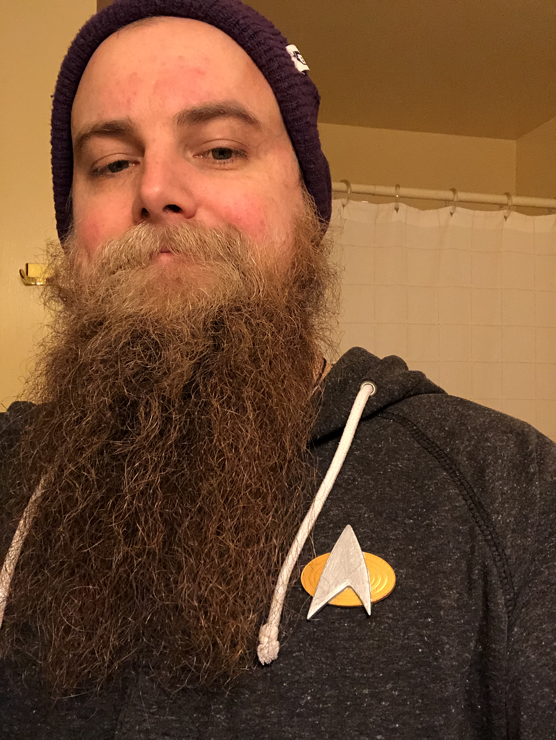 Communicator Badge being worn