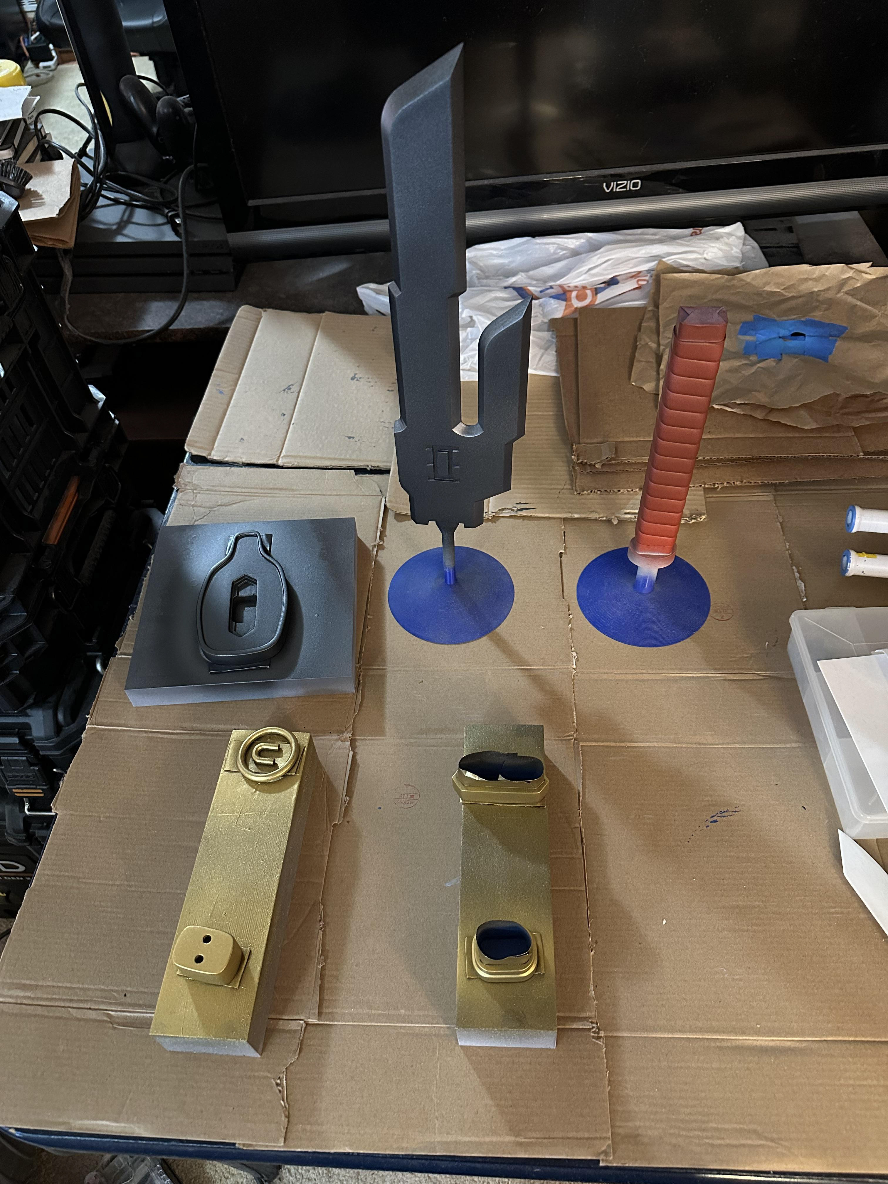 Pieces of Inverted Spear of Heaven on painting stands with near final color