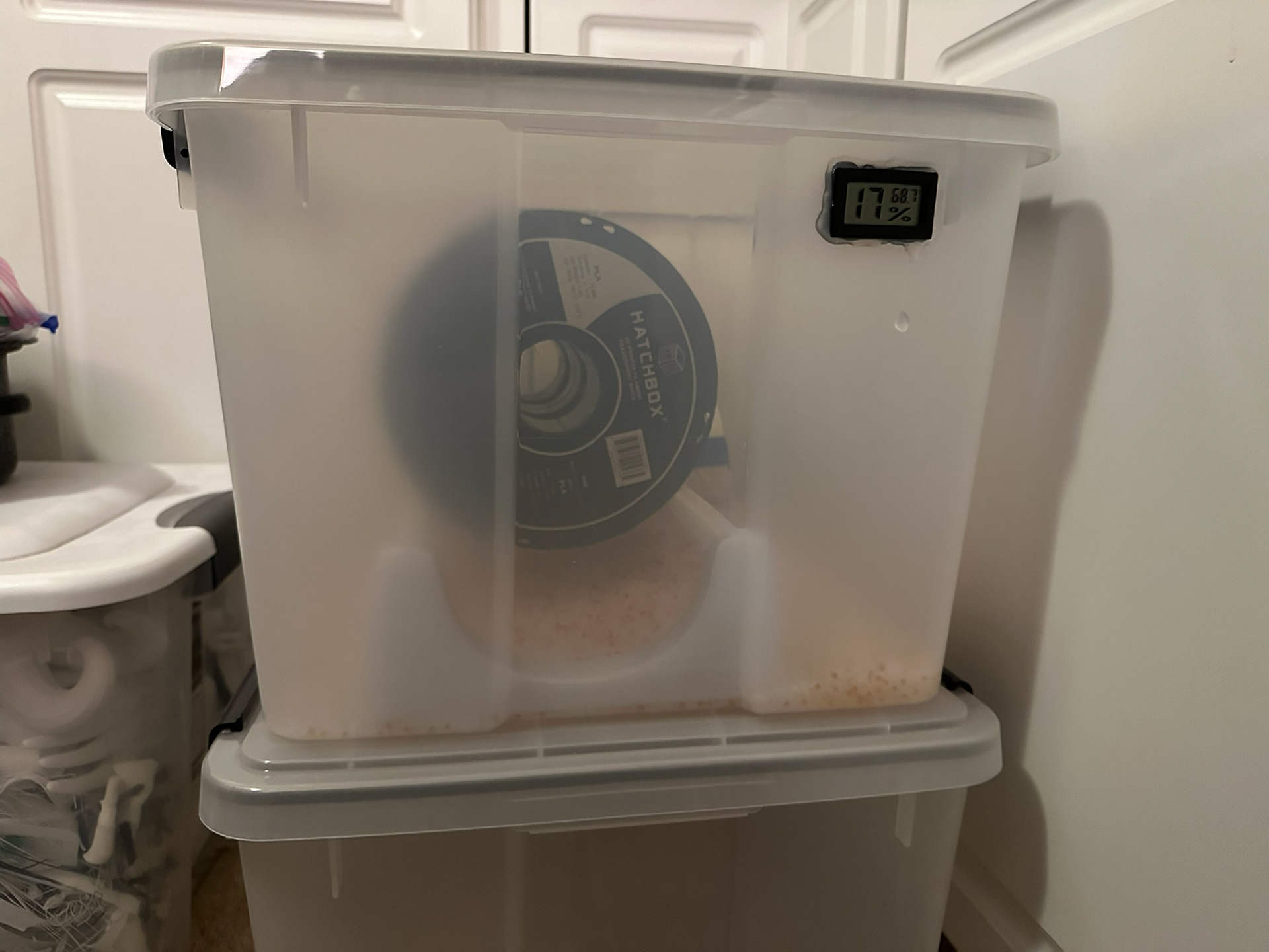 Dry box filament spool rack in dry box holding spools front view