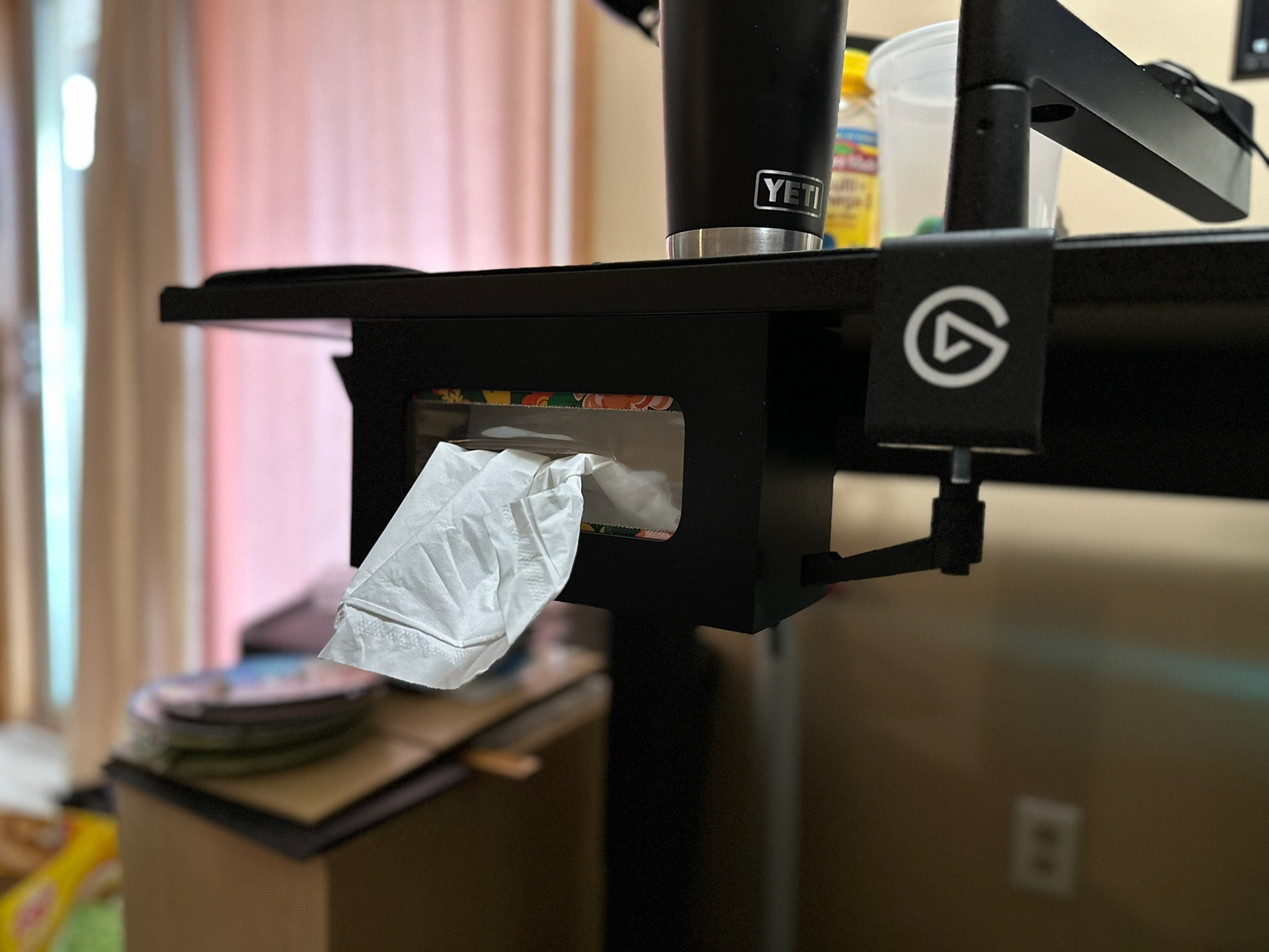 Kleenex box hanger holding kleenex box to underside of desk