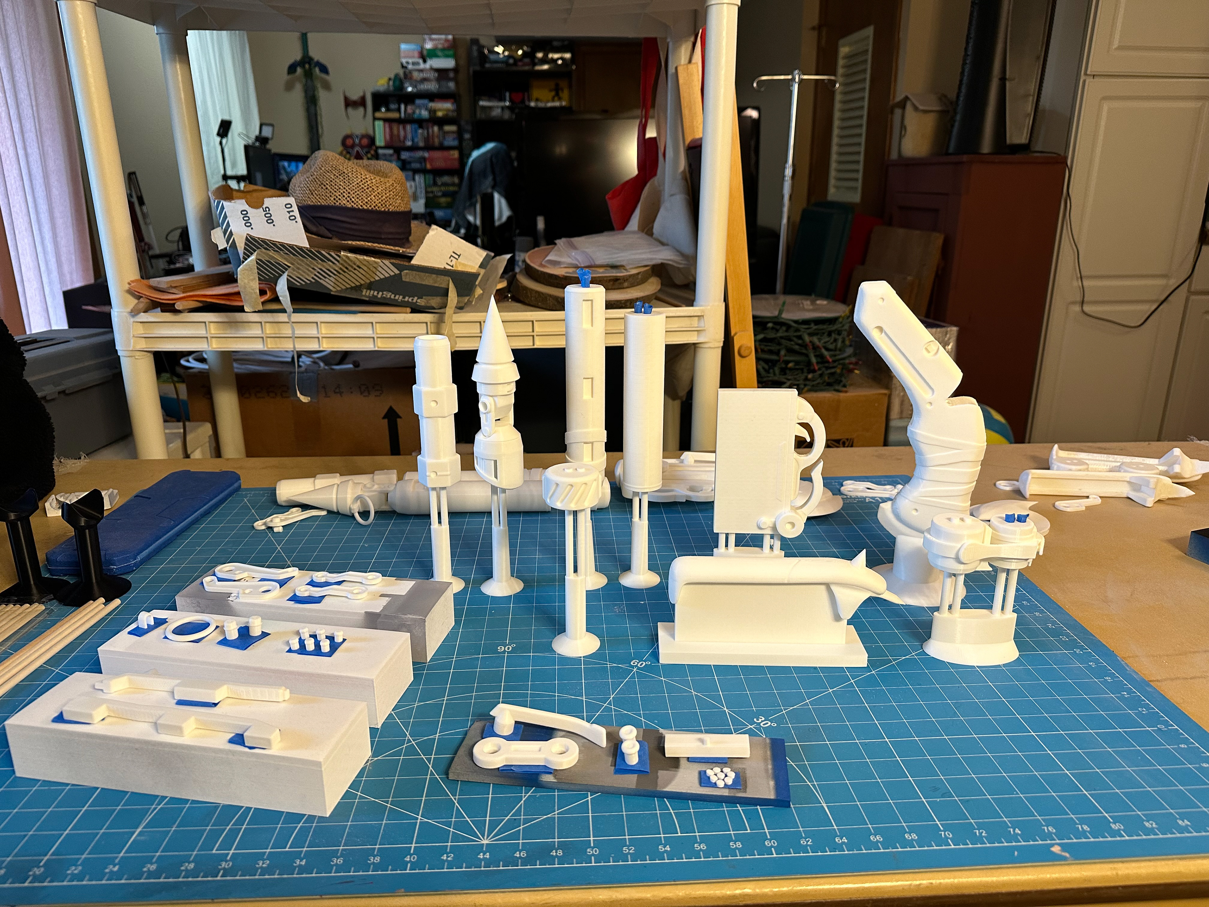 Raw printed pieces arranged on painting stands