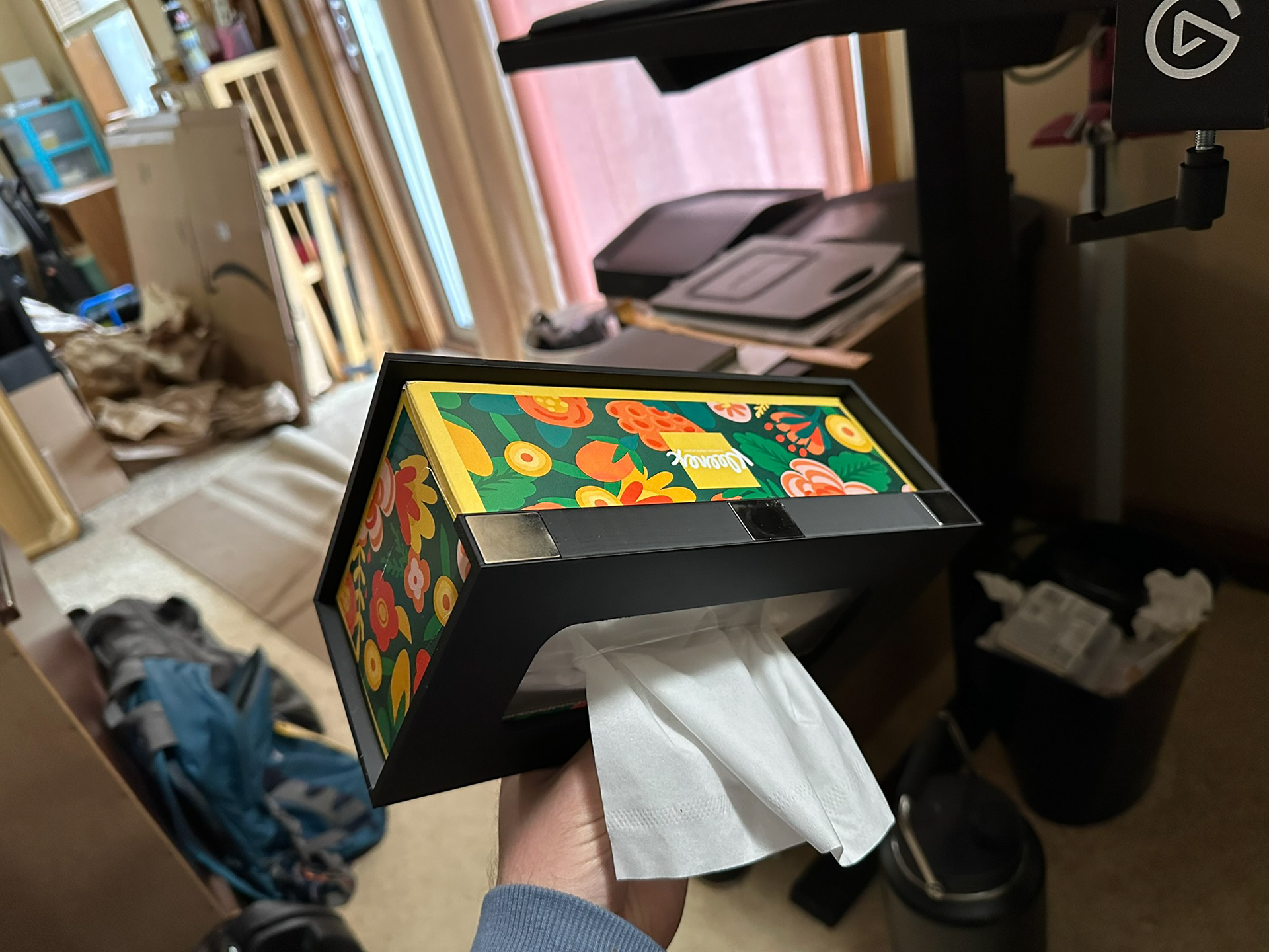 Kleenex box hanger holding kleenex box showing off magnets