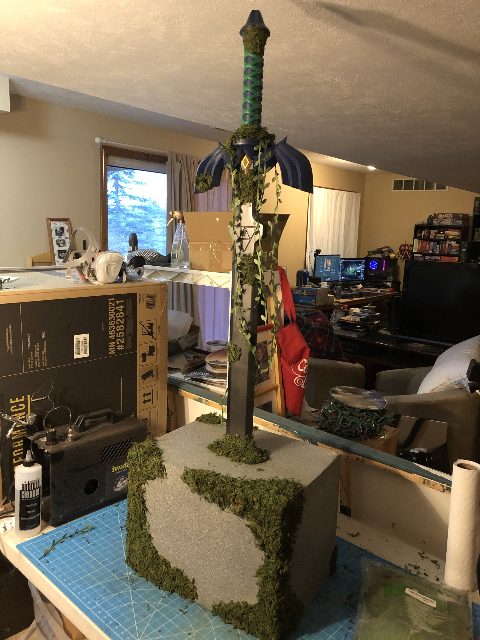 Finished Master Sword in stone base with fake moss and vines