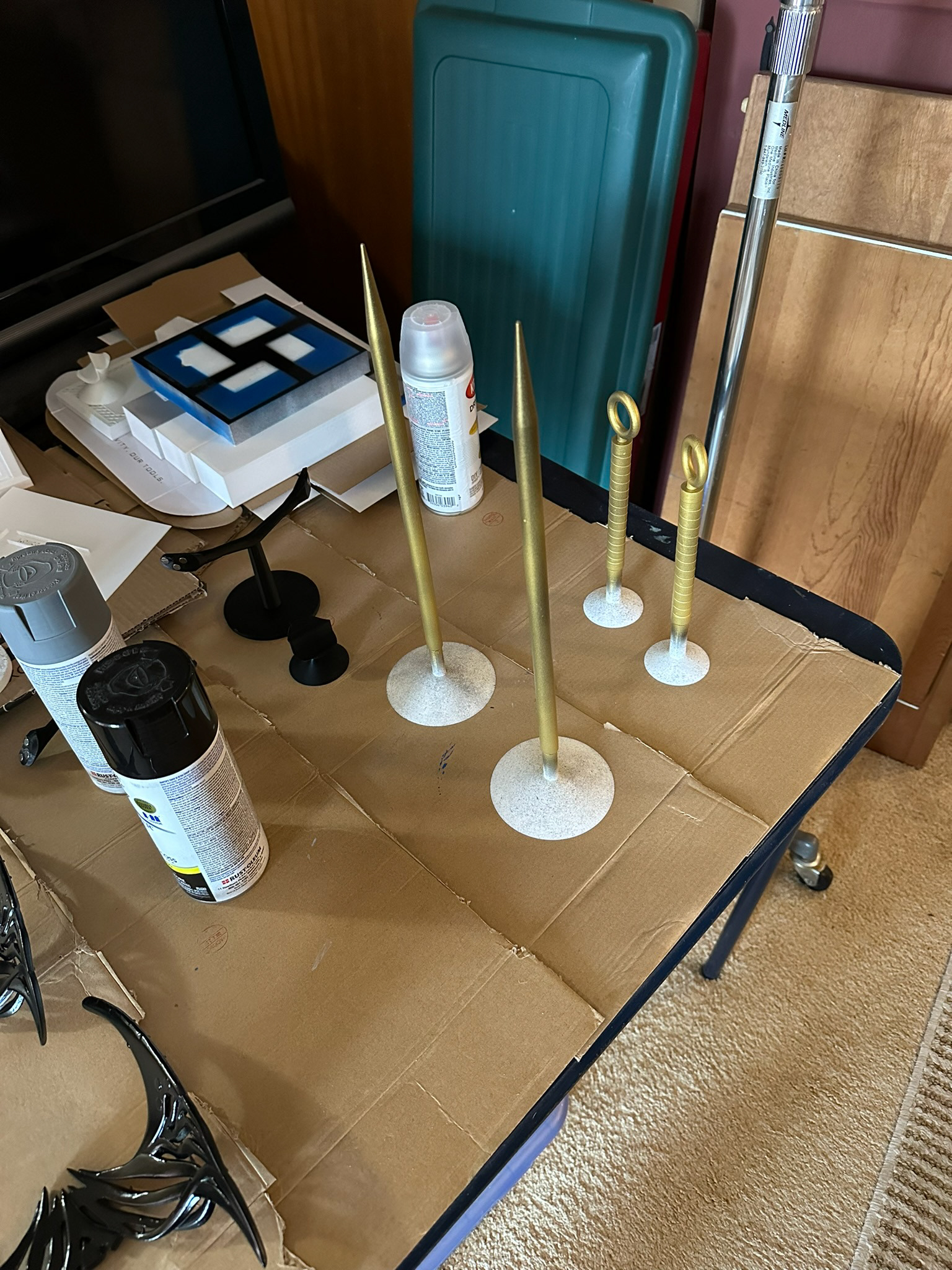 Yor stilettos on paint stands with first coat of paint