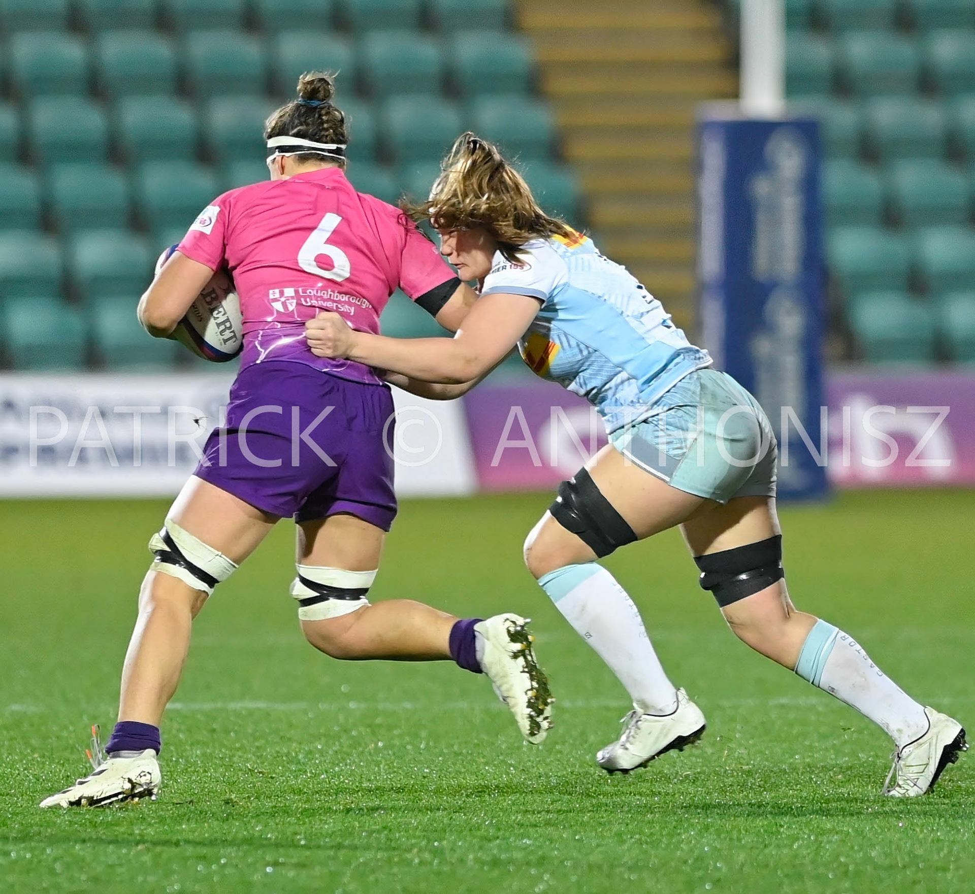 NORTHAMPTON, ENGLAND- Nov -27 - 2022 : Rachel Malcolm (c)of  Loughborough is stop by Lucy Heryet   Harlequins  during the match between Loughborough Lightning Vs Harlequins at Franklin's Gardens on November 27, 2022 in Northampton, England