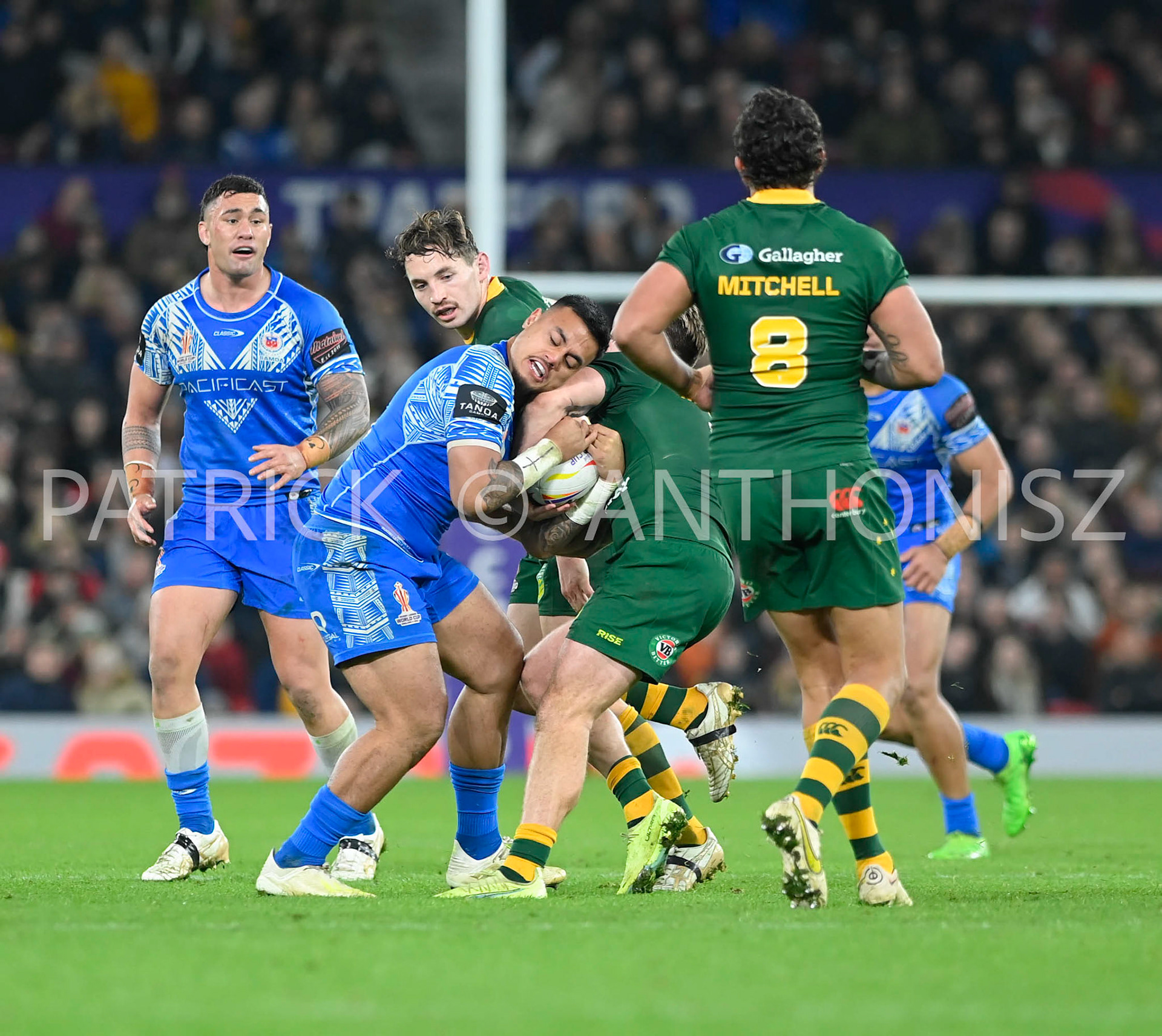 Manchester   ENGLAND - NOVEMBER 19. Spencer Leniu of Samoa tries to keep the ball from the Australia defence during  the Rugby league World Cup Mens Final  between Australia and Samoa at the   Old Trafford Stadium on November 19 - 2022 in Manchester England.