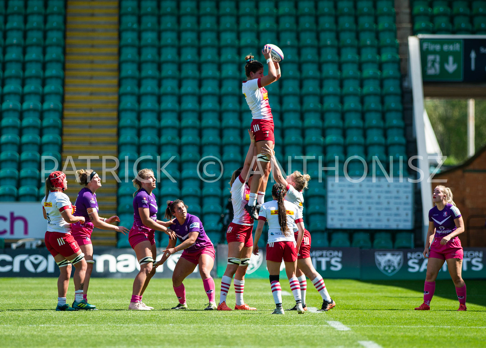 Northampton -14–May-2022. the Harlequins rugby team takes a drink during the  Loughborough Lightning Vs Harlequins Womens match at cinch Stadium Franklin's Gardens Northampton  .