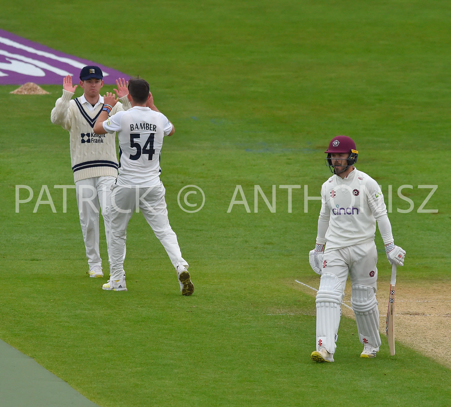 NORTHAMPTON, ENGLAND - April 15 2023 :Ethan Bamber celebrates with his team mates after taking the wicket of  Lewis Mcmanus Day 3 of the LV= Insurance County Championship match between Northamptonshire and   Sat  April  15 at The County Ground  in Northampton, England.