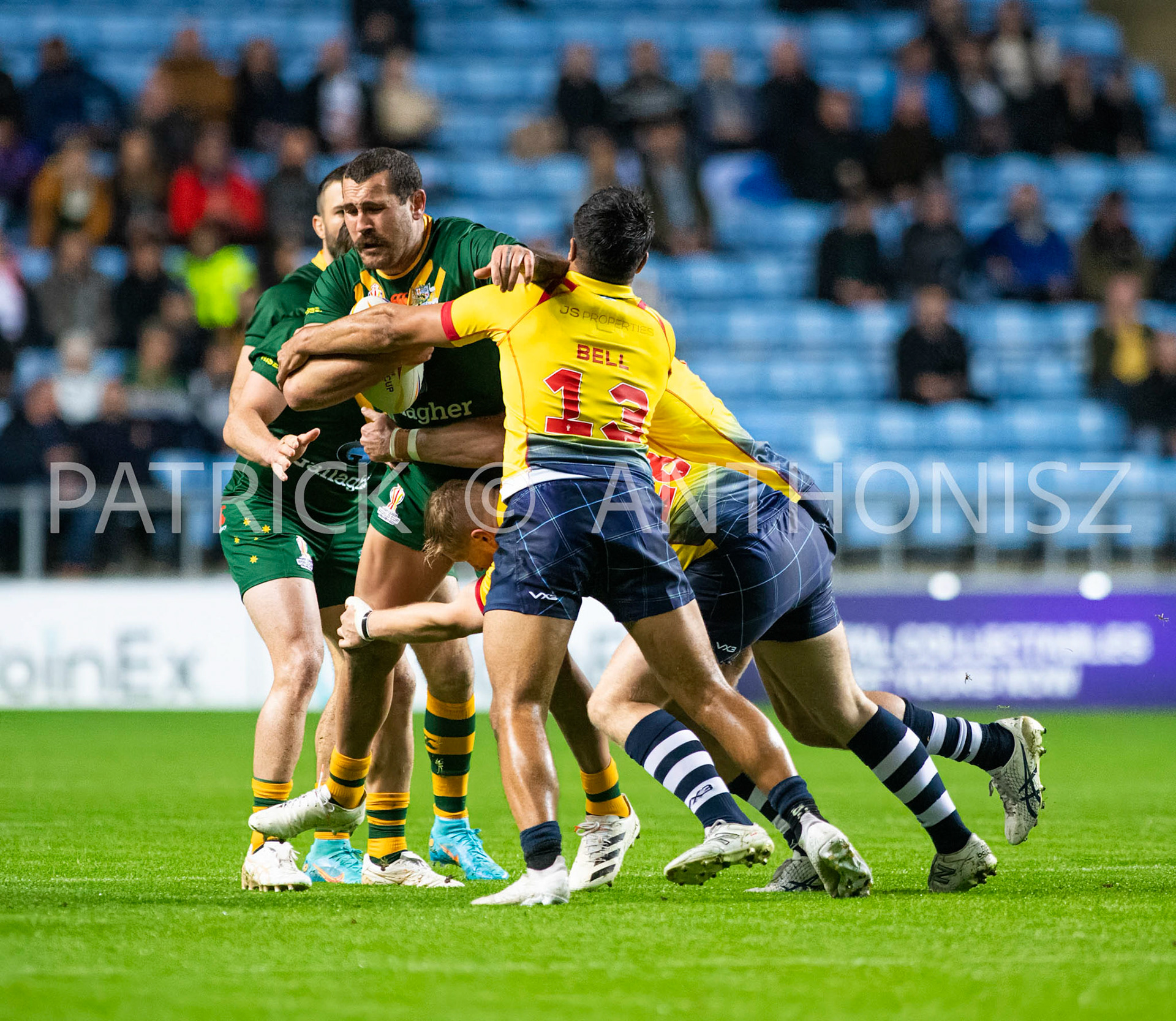 Coventry England  21st October:  Reagan Campbell-Gillard of Australia is held by James Bell of Scotland during the Rugby League World Cup 2021 between Australia Vs Scotland  at  Coventry Building Society Arena on 21st October 2022 Australia 84: Scotland 0