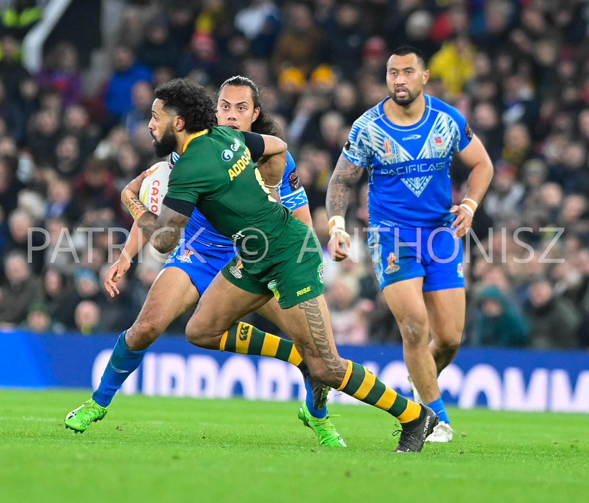 Manchester   ENGLAND - NOVEMBER 19.Josh Addo-Carr of Australia runs with the ball  during  the Rugby league World Cup Mens Final  between Australia and Samoa at the   Old Trafford Stadium on November 19 - 2022 in Manchester England.